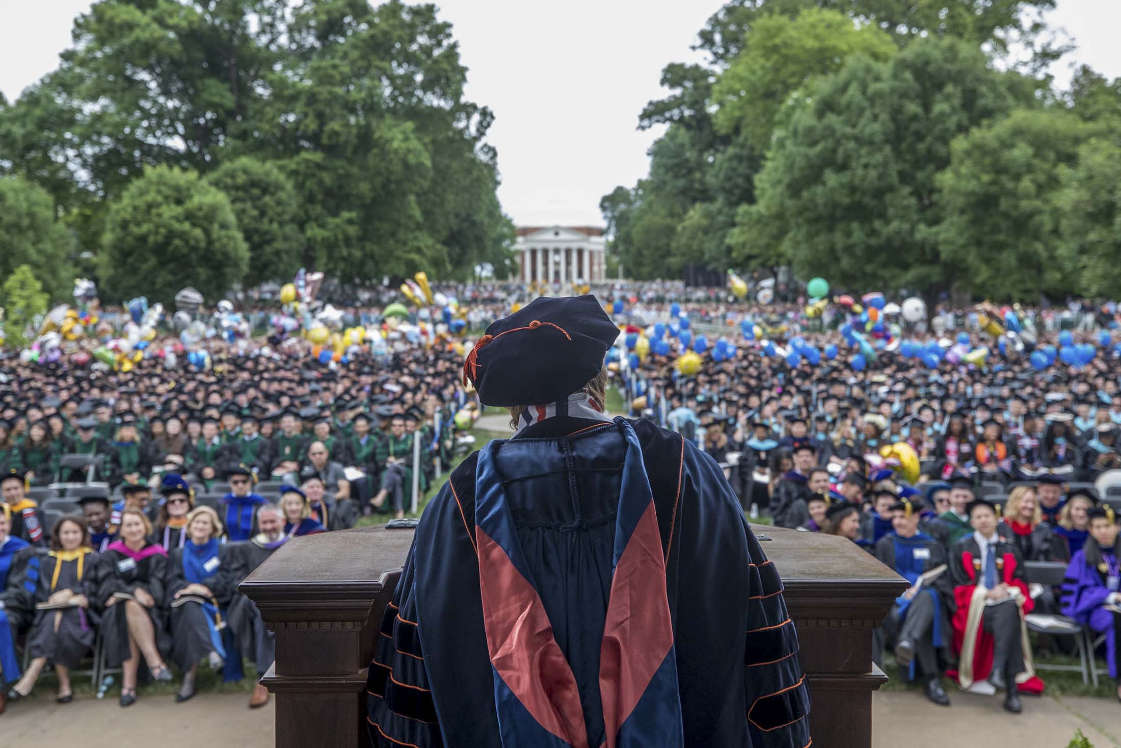 Sullivan speaking at a podium during graduation on the Lawn