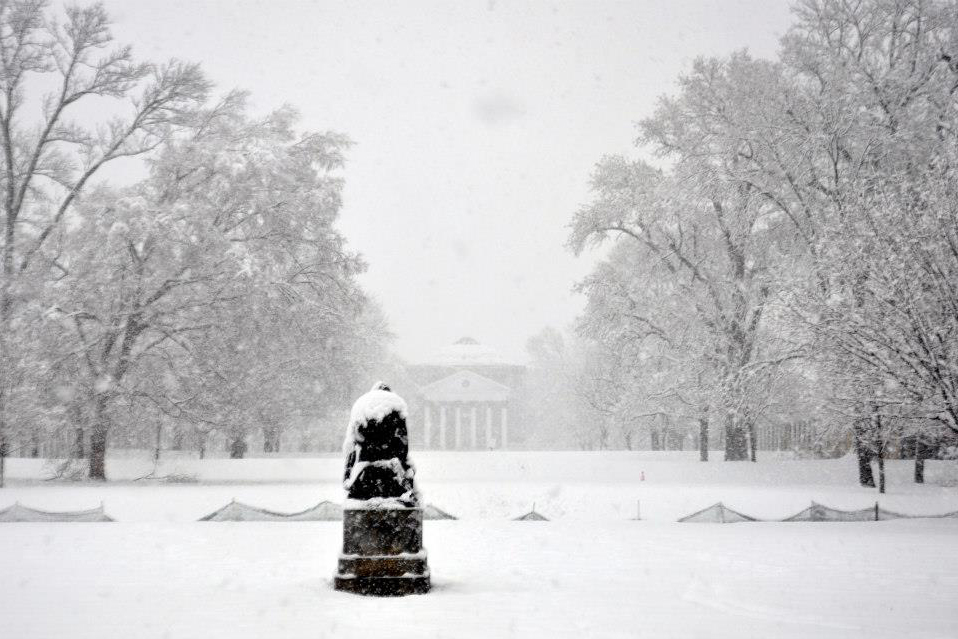 The lawn and Rotunda covered in snow as the snow continues to fall