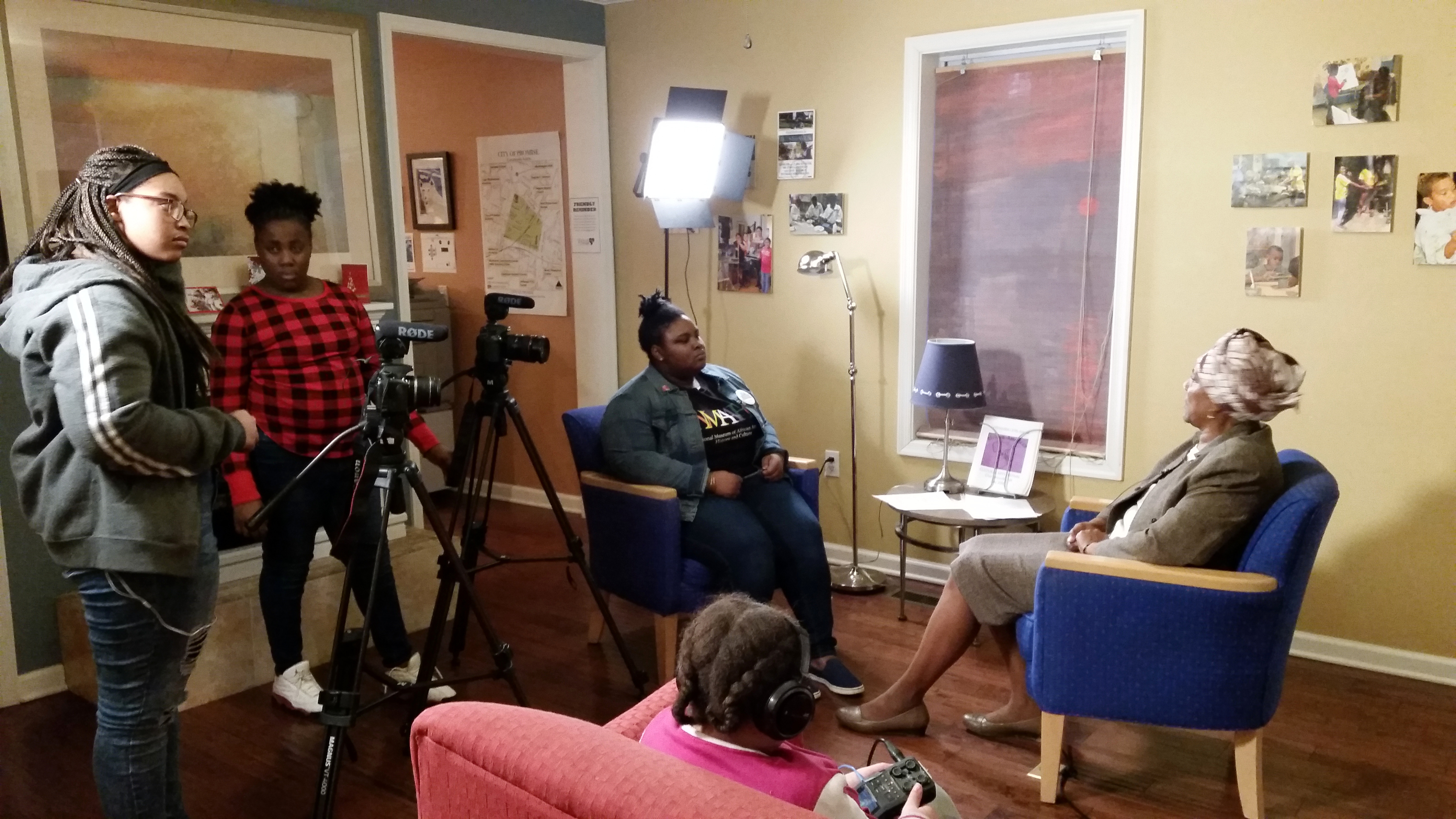 Charlottesville teens filmed an interview with local community activist Maxine Holland for their video “Black Girlhood: Access and Assets.” From left, Tykeisha, Mauriana, Zyahna, Holland and BriAsia (foreground). (Photo courtesy of Light House Studio) 