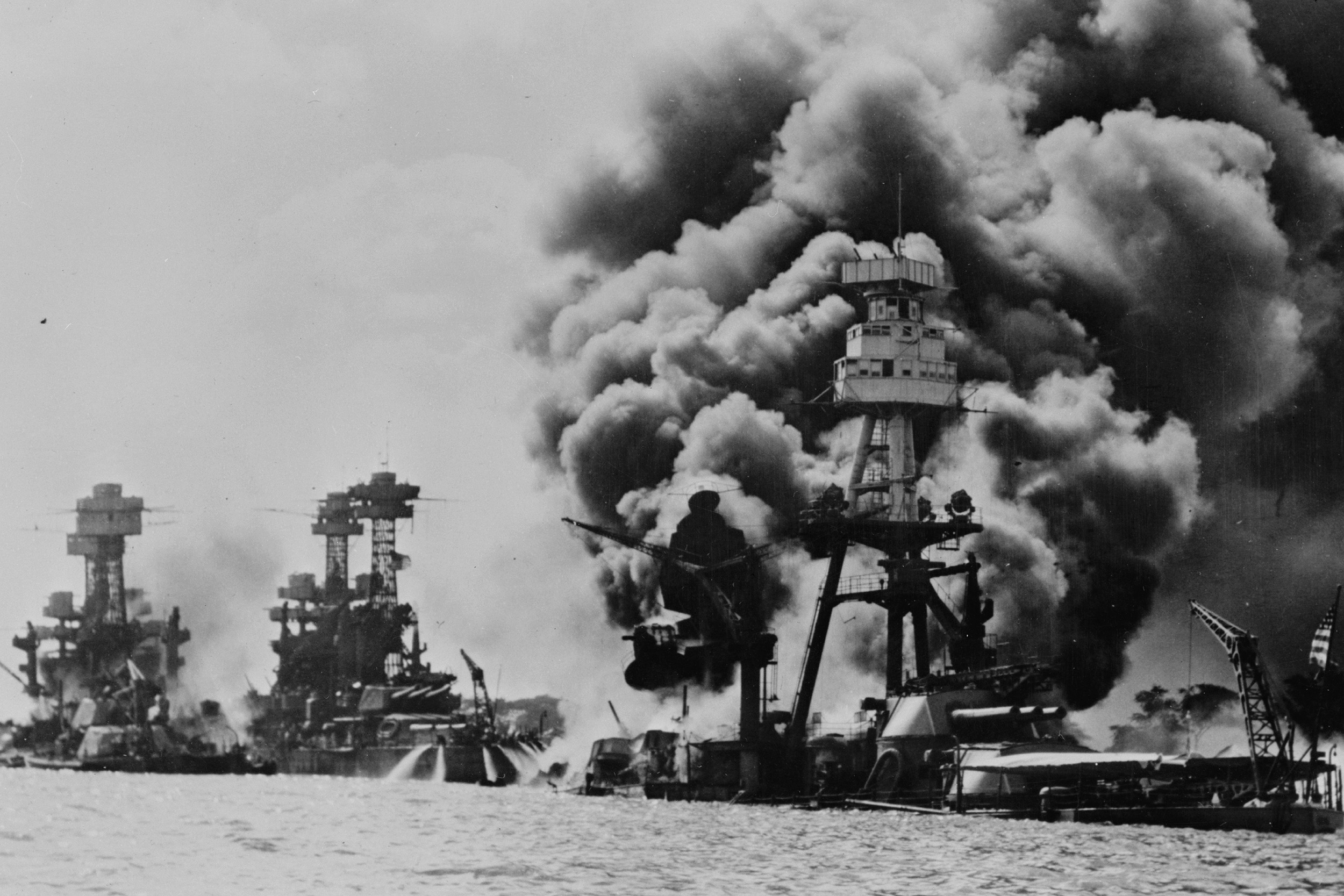 From left, The USS West Virginia was severely damaged; the USS Tennessee was damaged; and USS Arizona sunk during the Japanese attack on Pearl Harbor