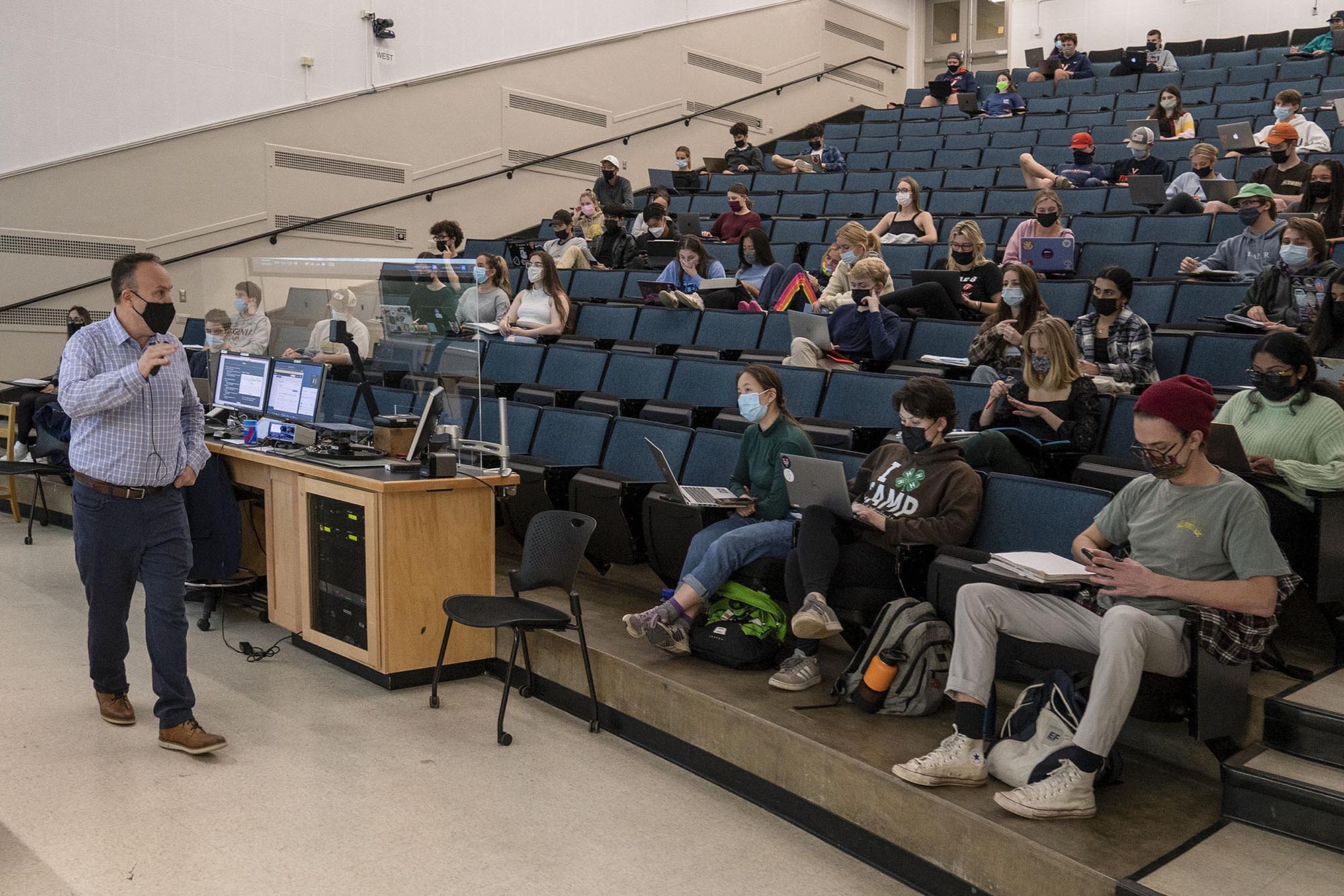 Chris Neu teaching a class in a lecture hall