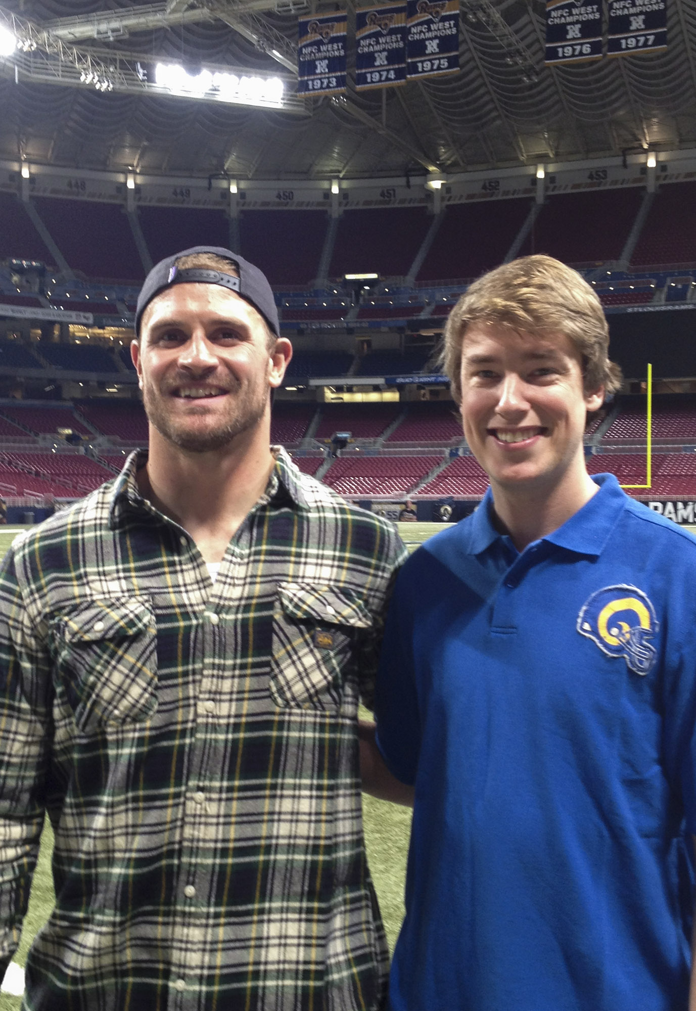 Chris Long, left, and Gunter, right standing in the LA Rams' stadium