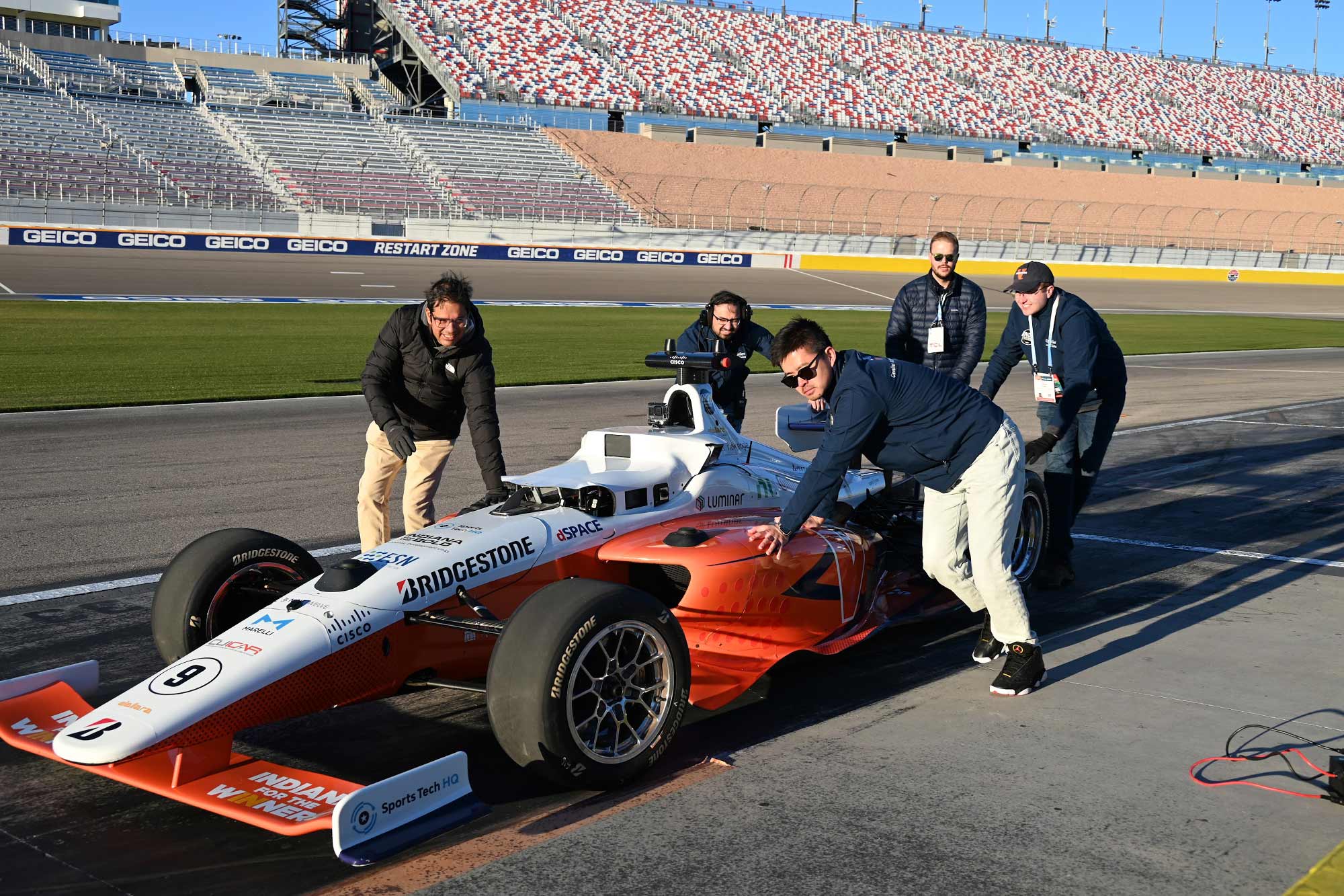 Team pushing Indy car