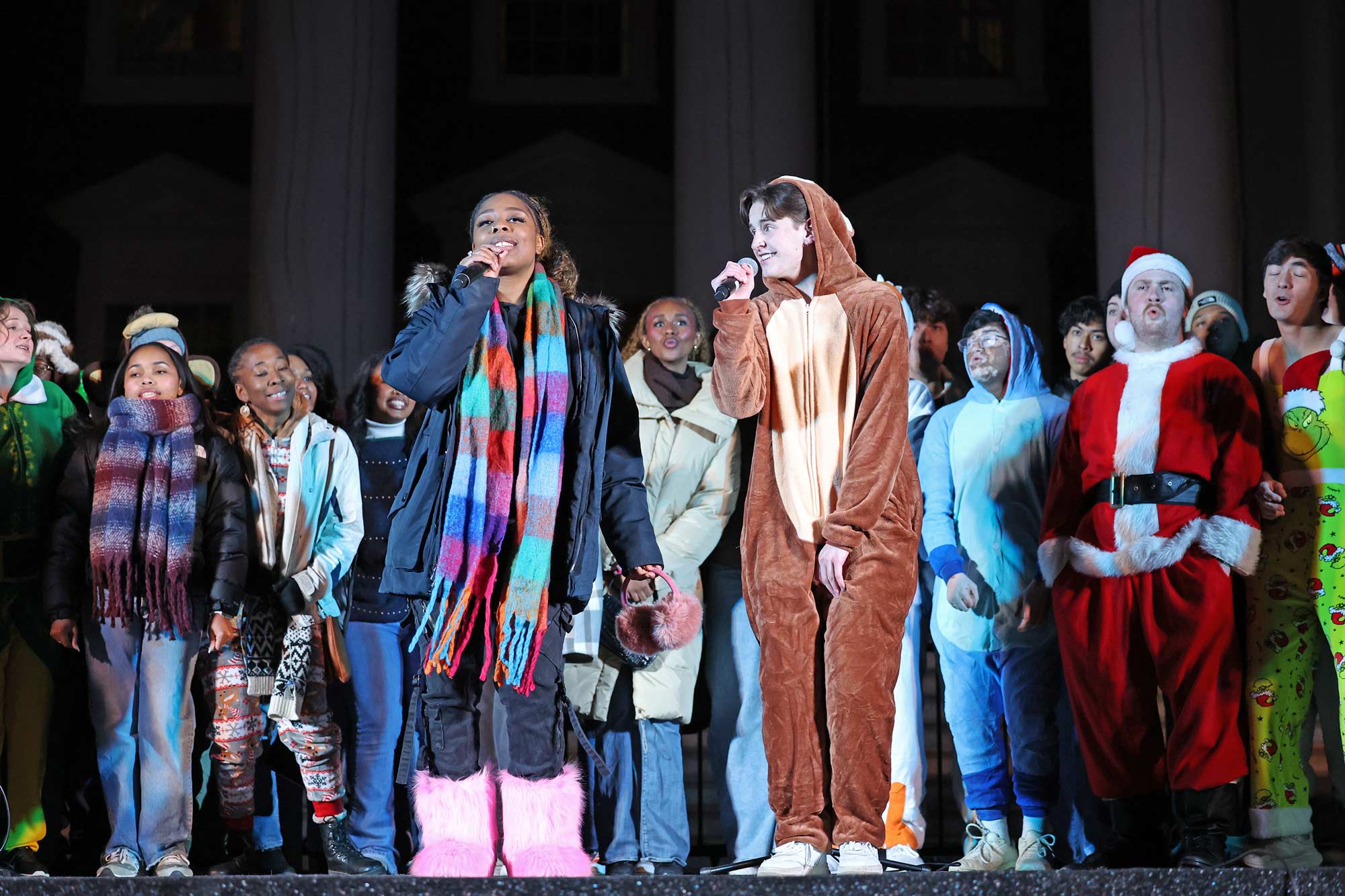 A singing crew in onesies in front of Rotunda