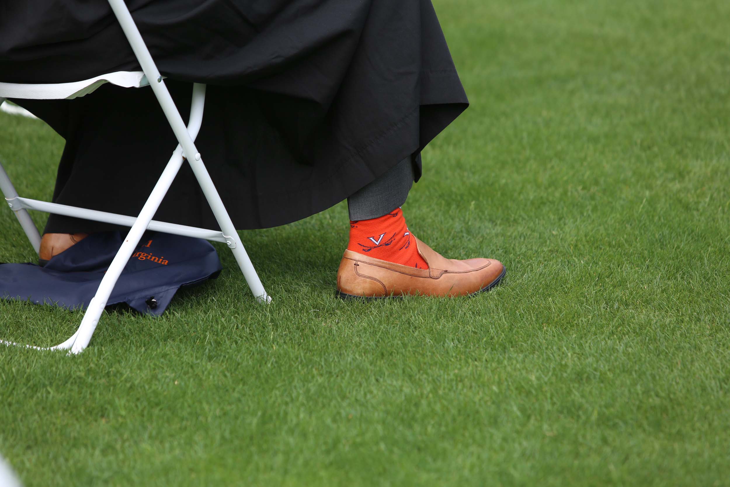 Graduate wearing orange UVA socks