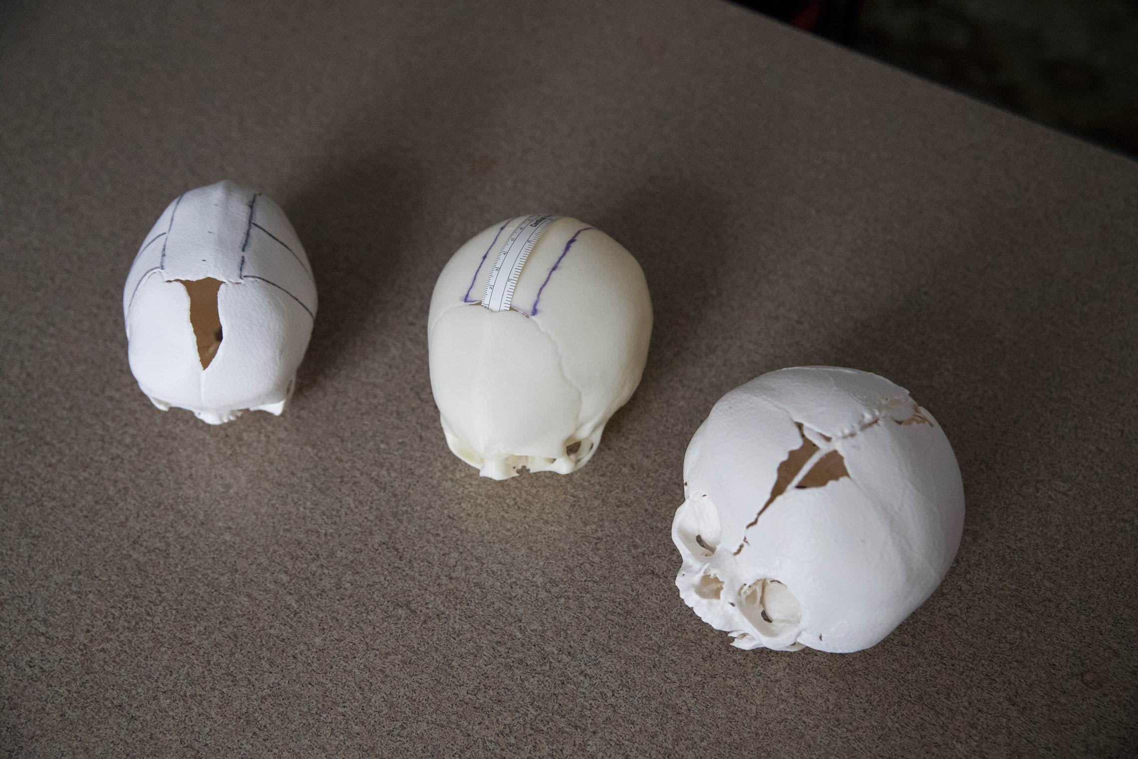 Three skulls on a table 