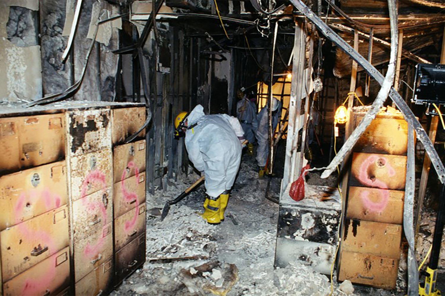 Investigators sift through ash and burnt remains of the pentagon