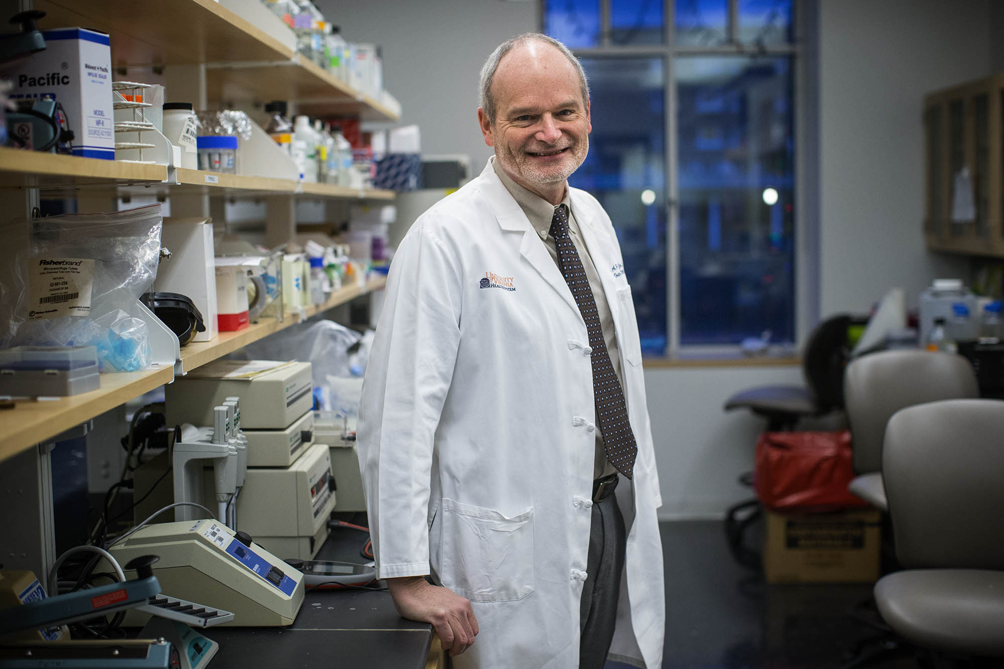 Dr. William Petri headshot in a lab