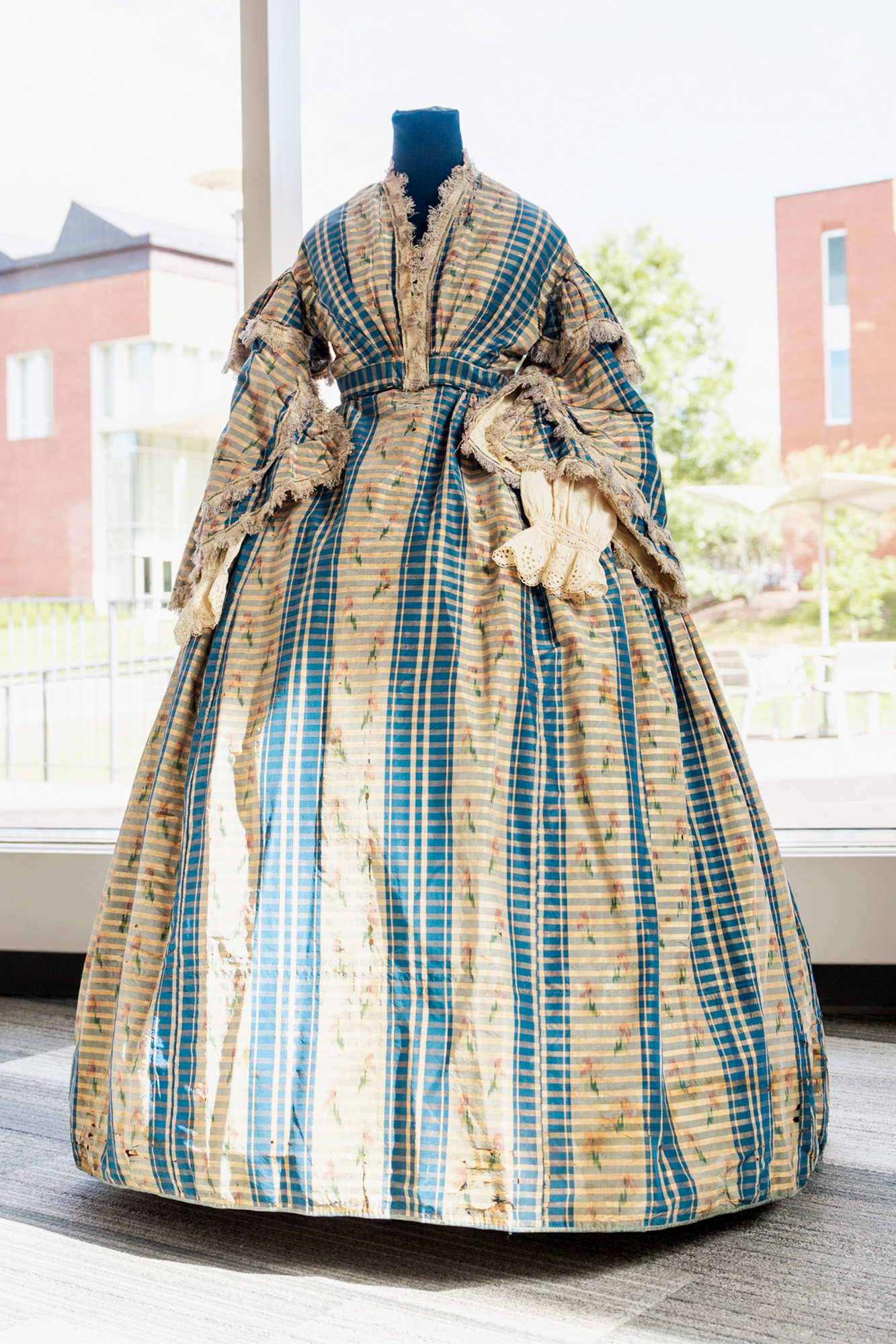 Full length view of a dress from the late 1850s.