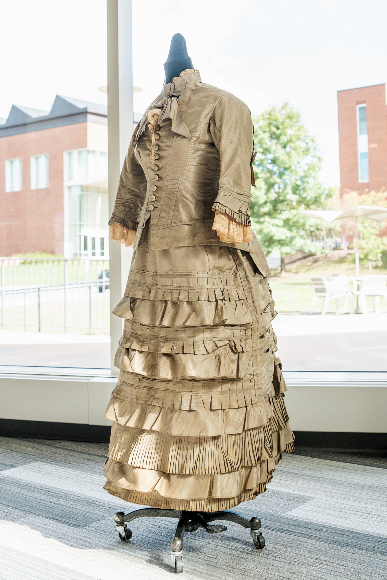 Full length view of a dress from the 1870s.