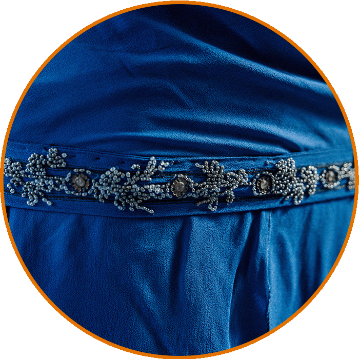 Close up of the dress from the 1920s showing a detailed view of the beaded drop-waist.