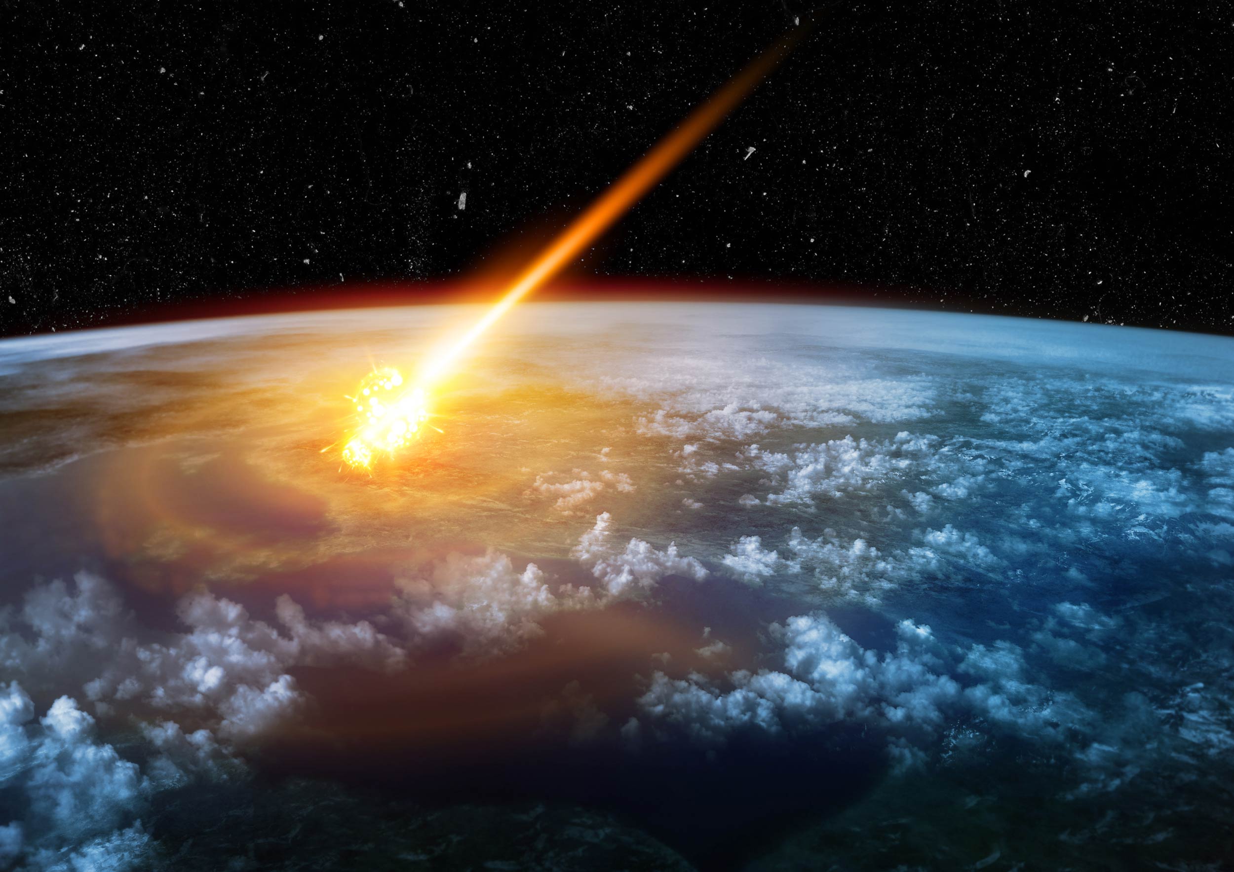 An illustration of space showing an asteroid reaching the Earth's surface.