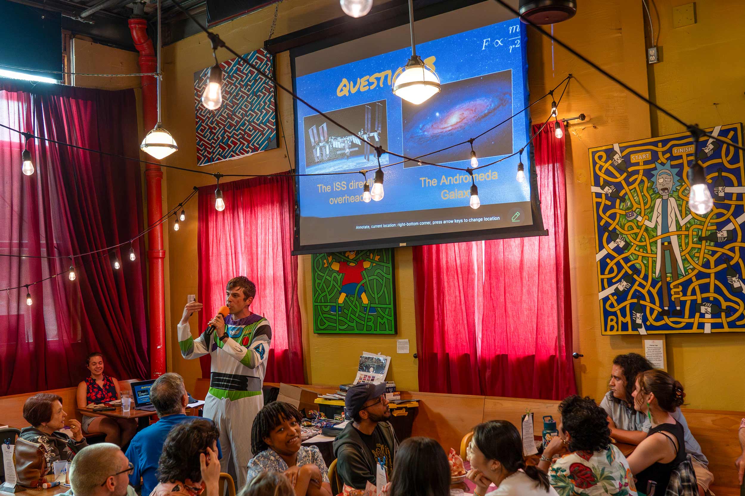 Matt Pyrall speaking at ”Astronomy on Tap C-ville” outreach at Firefly Restaurant & Game Room