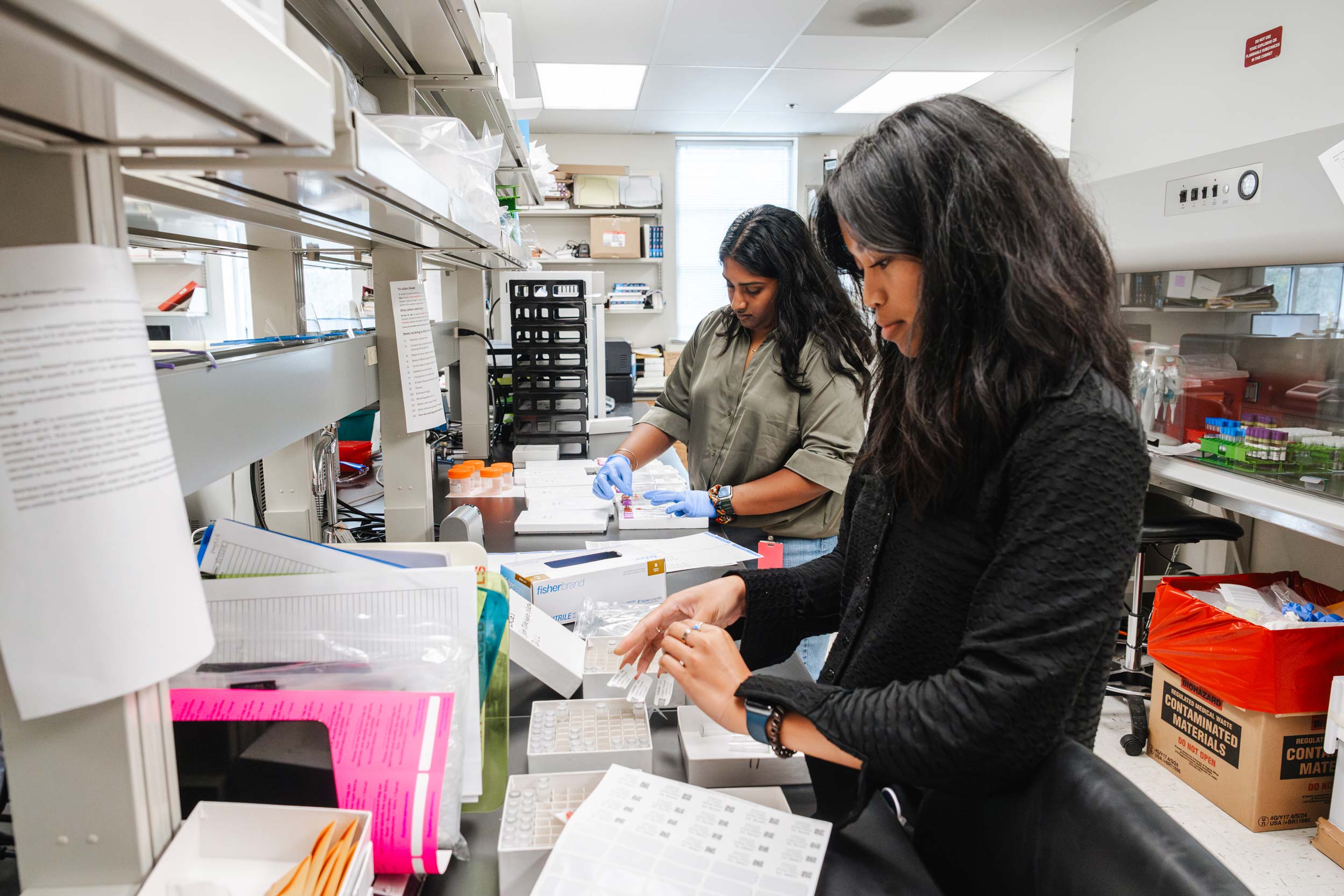 Lab specialists Samyukta Venkatesh and Alexa Ramirez working in a lab setting