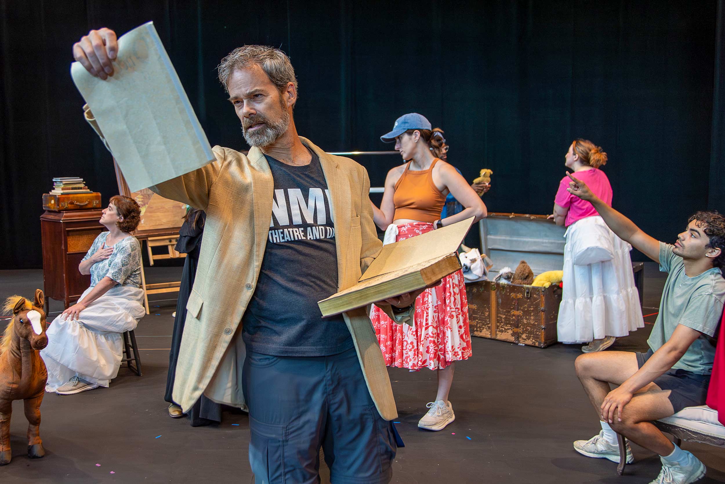 actors rehearsing a stage musical number