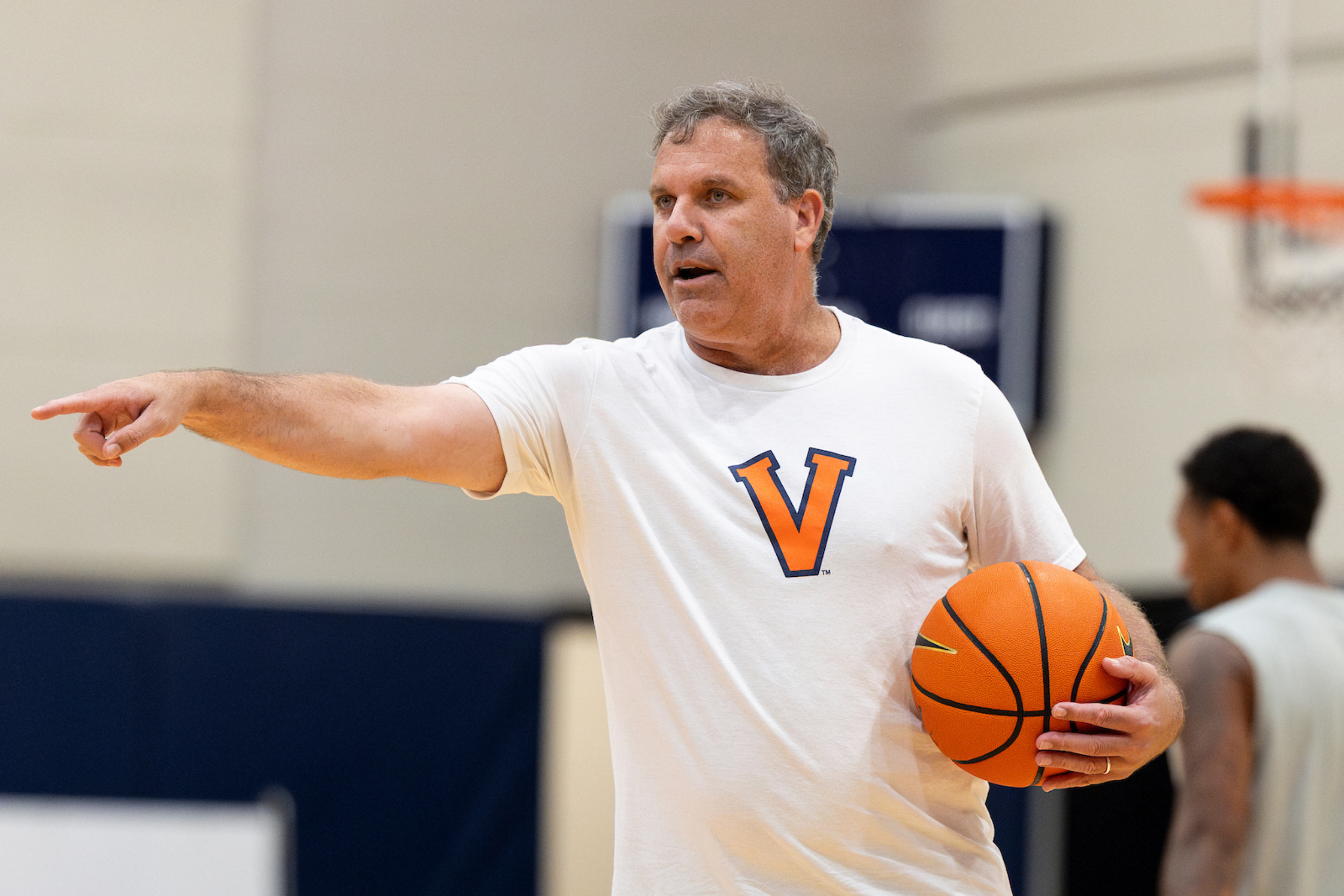 Candid of Griff Aldrich holding a basketball on a basketball court