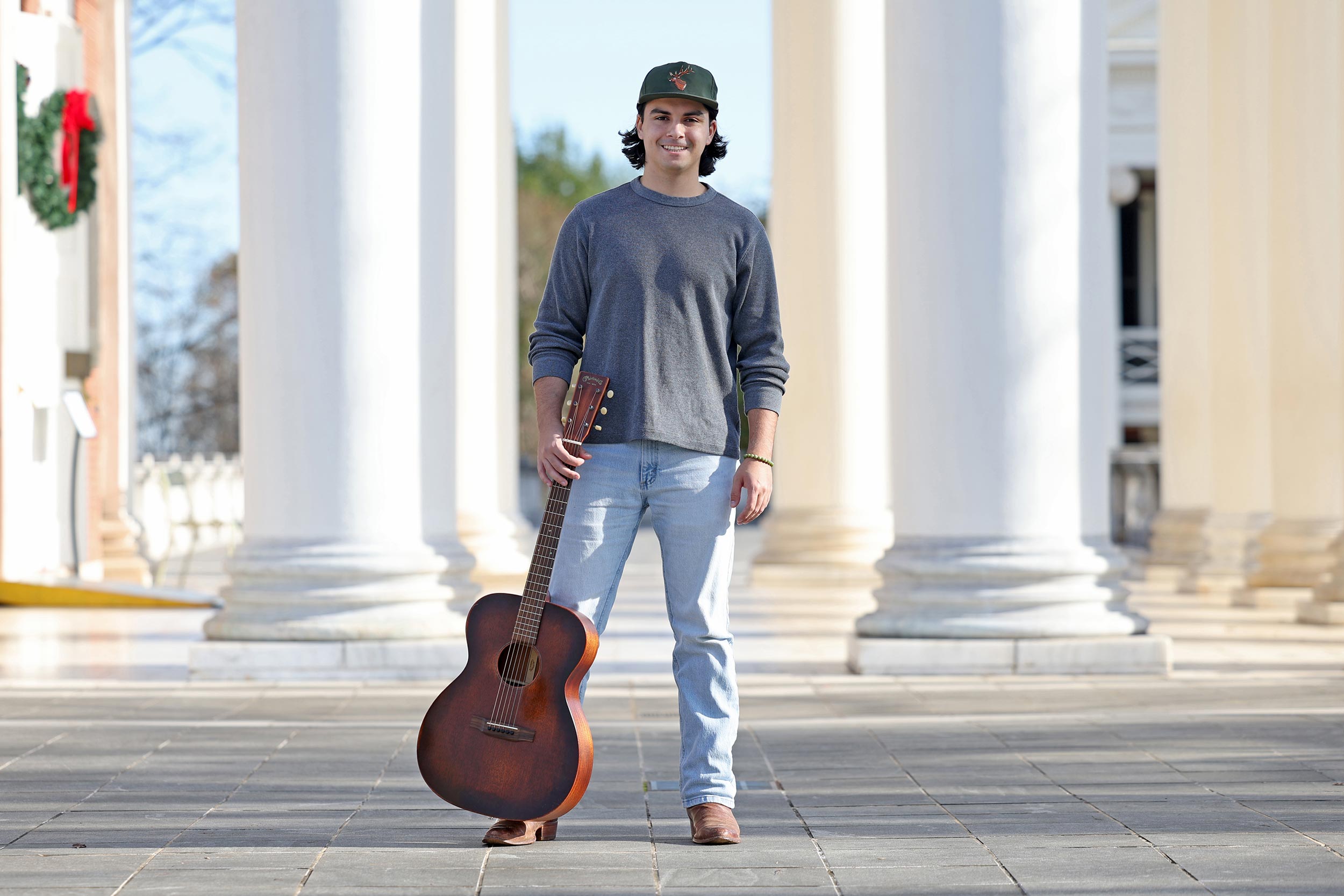 Luke Richard Powers poses with his guitar