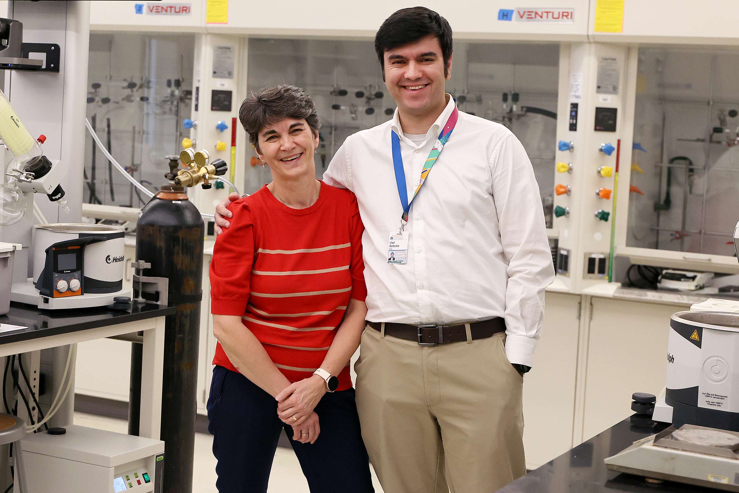 Mother and son, Laura and Vlad Serbulea pose in a teaching lab