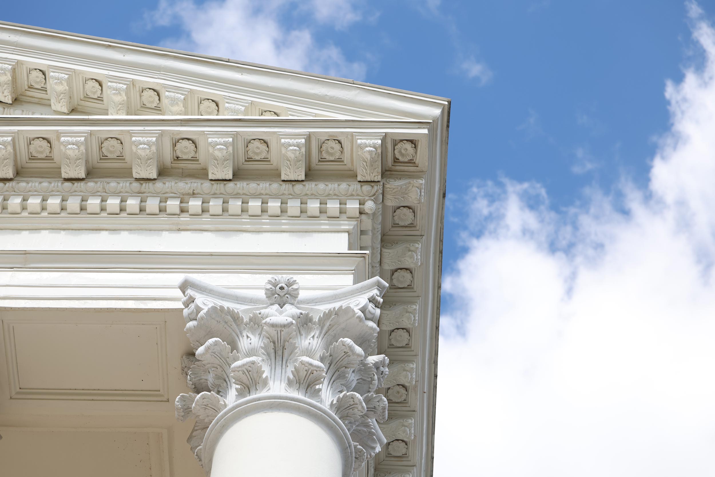 looking up at the capital of one column of the UVA Rotunda. 