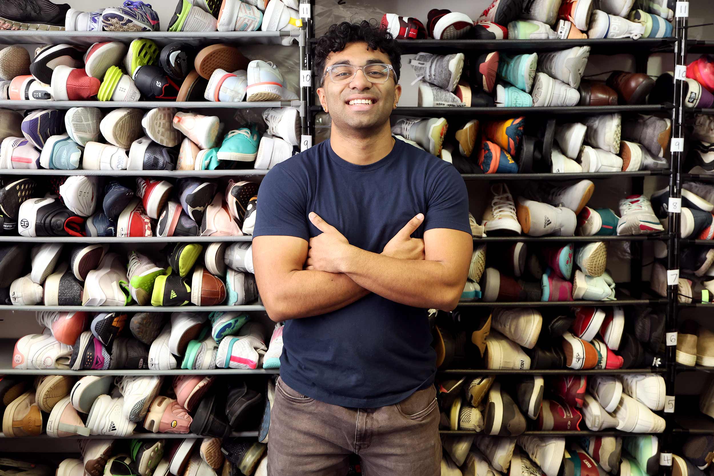 Portrait of UVA student Rajan Chidambaram with a background of shoes.