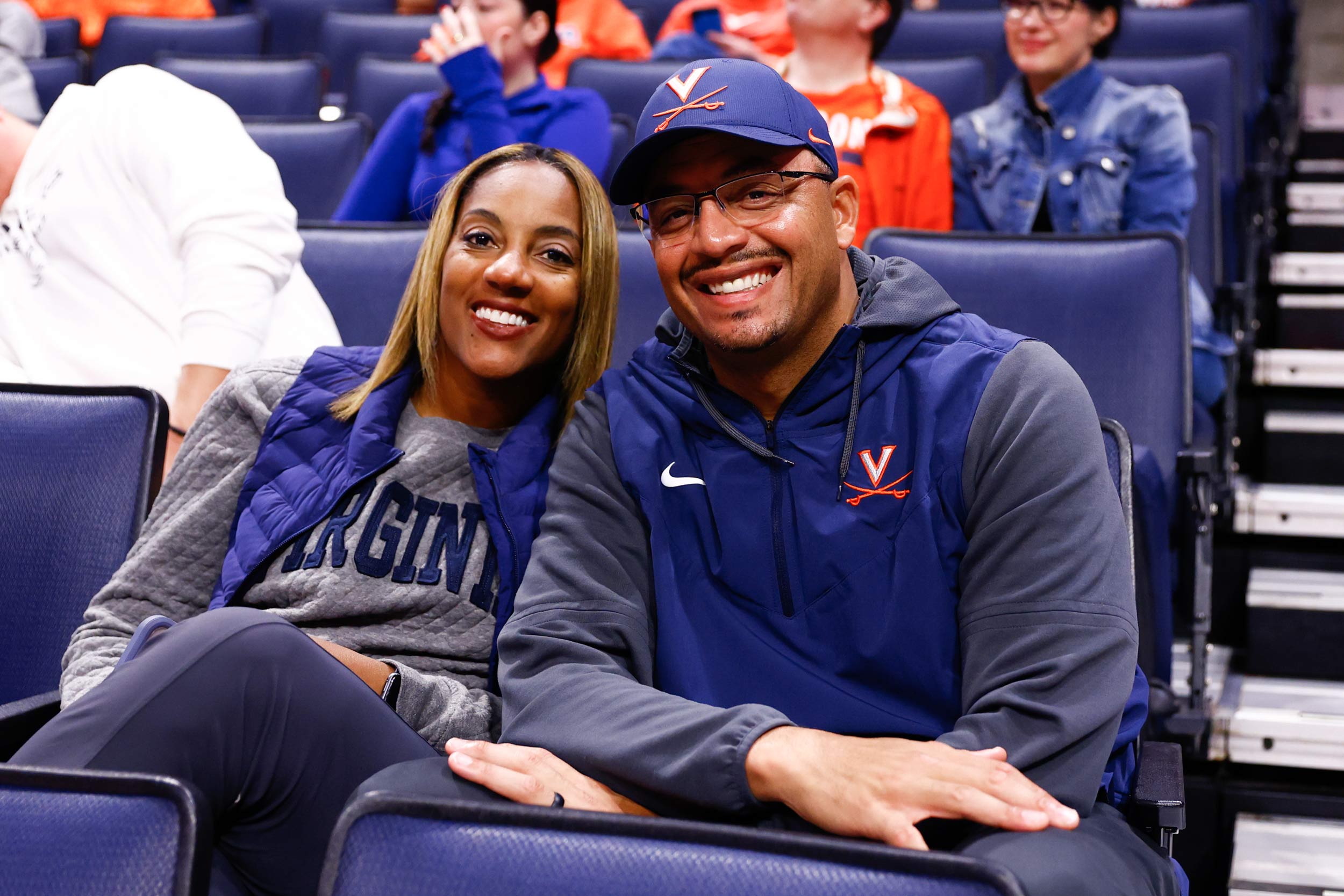 Tamika Elliot and Tony Elliot sitting in John Paul Jones arena at UVA