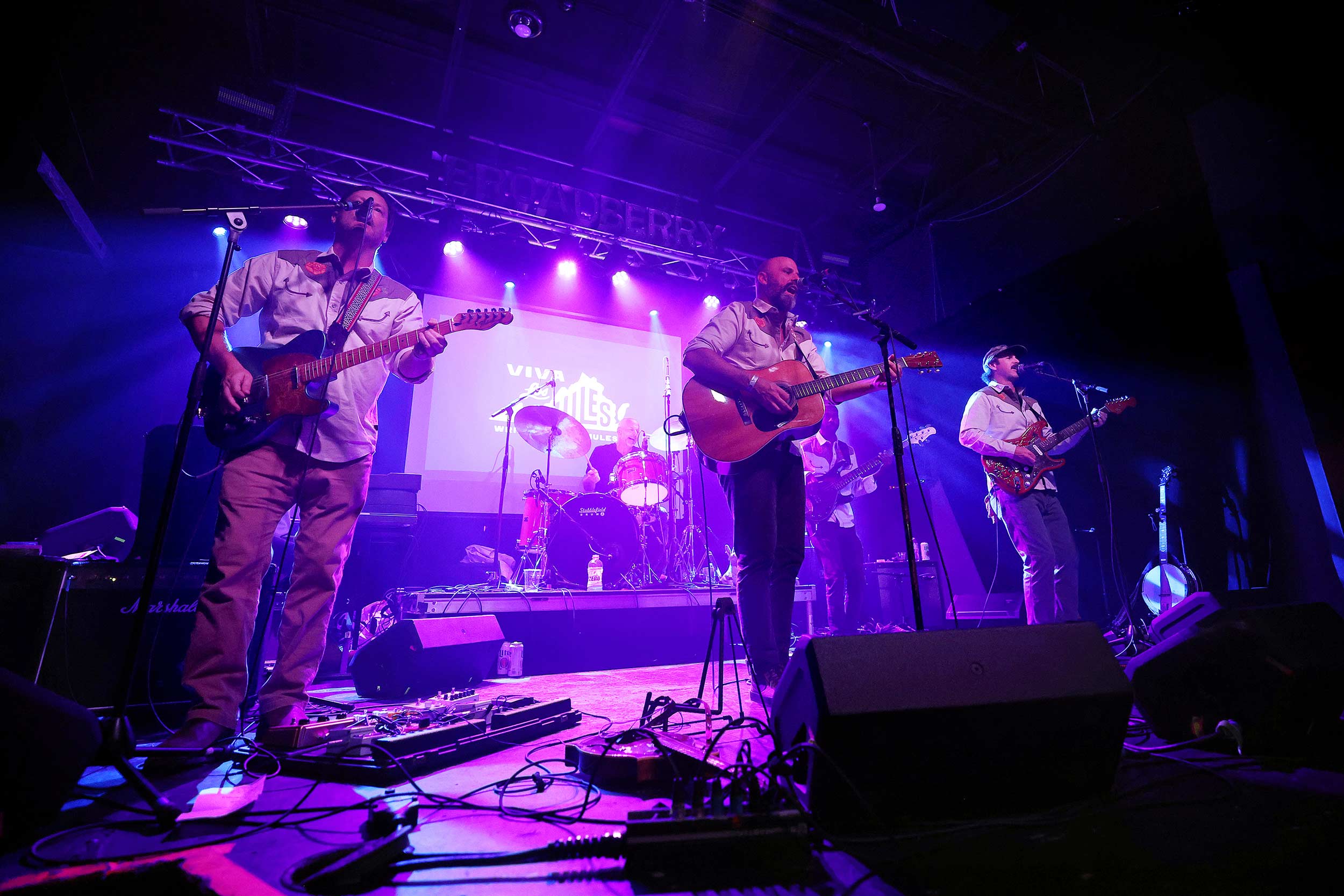 An action shot of the band playing in Richmond