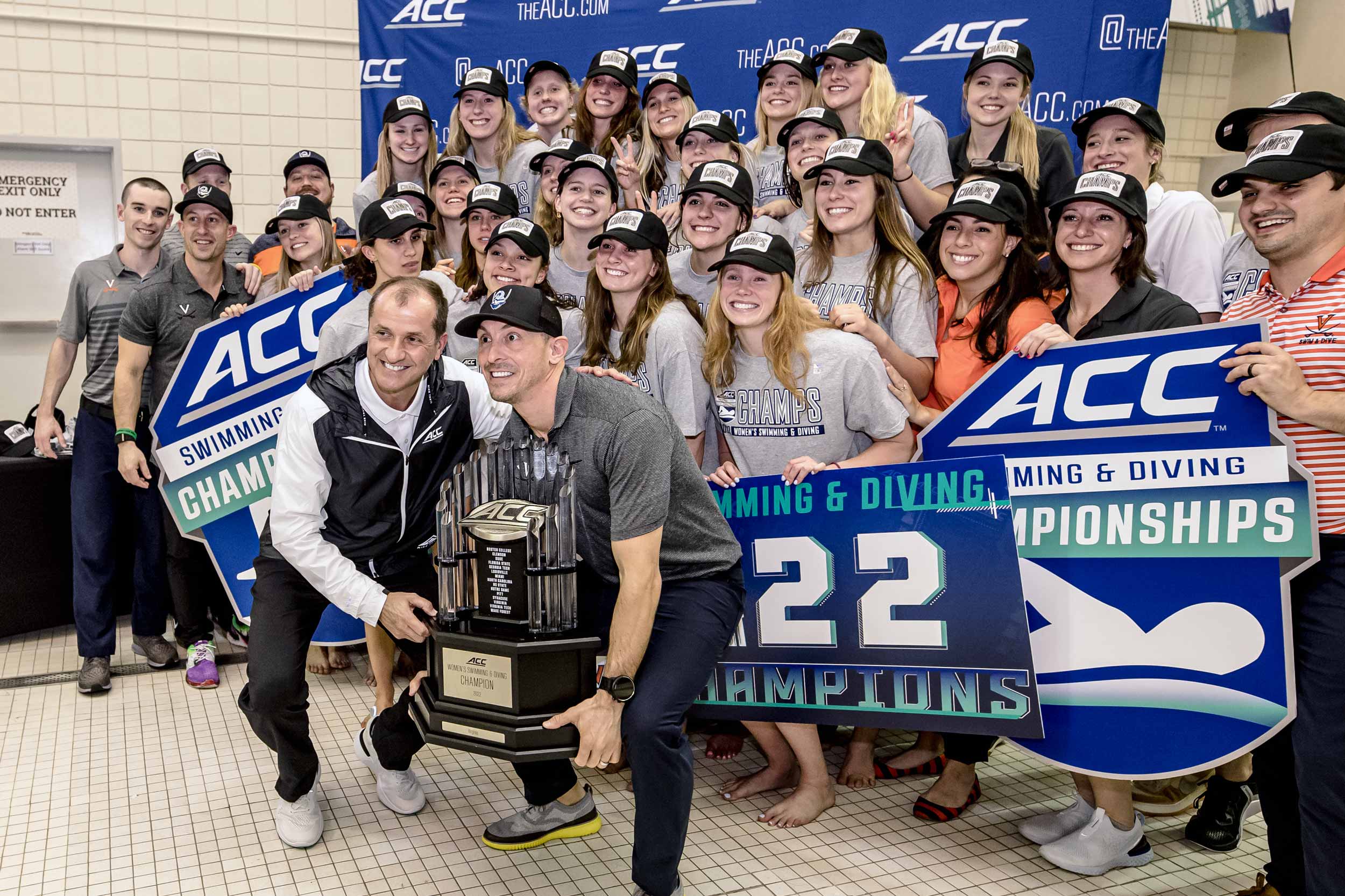 UVA womens swimming team with the trophy for their ACC title win