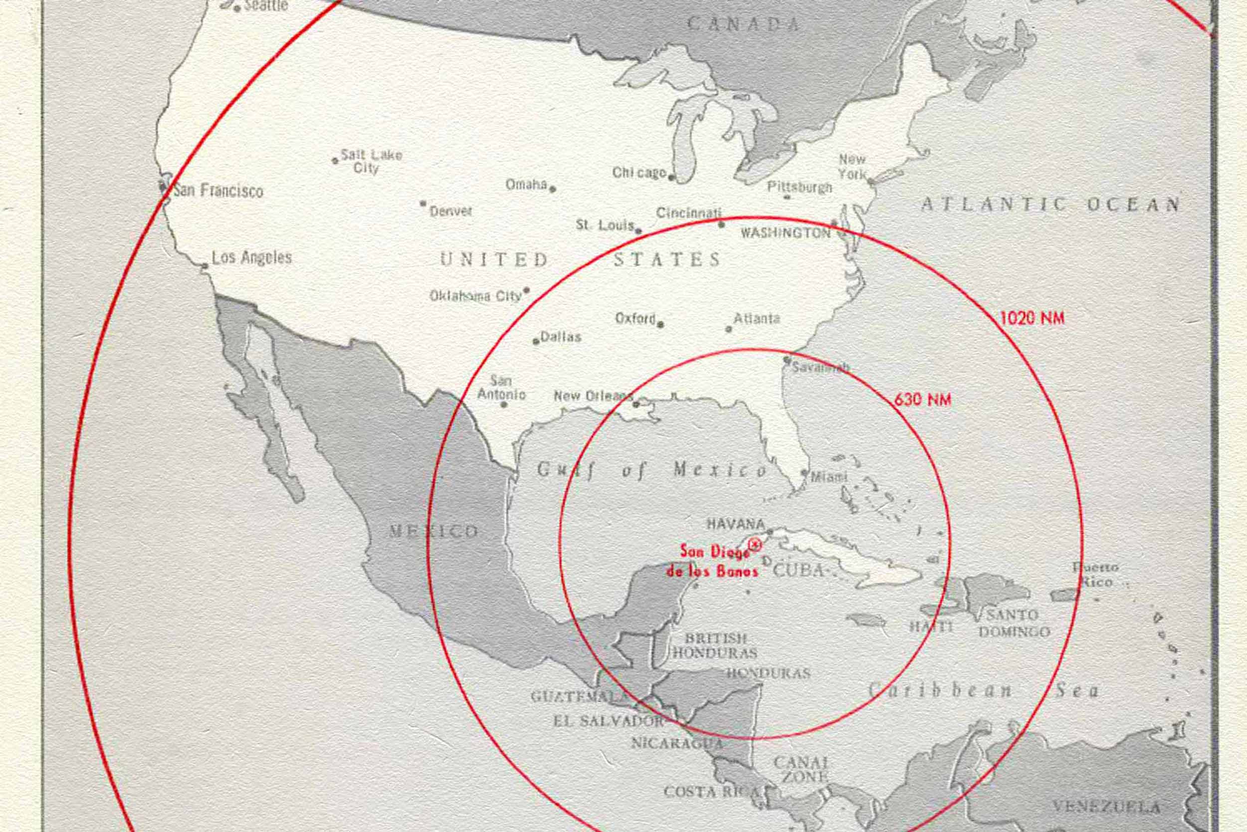 Concentric red circles overlaid on a map of North, Central and South America, centered on Cuba
