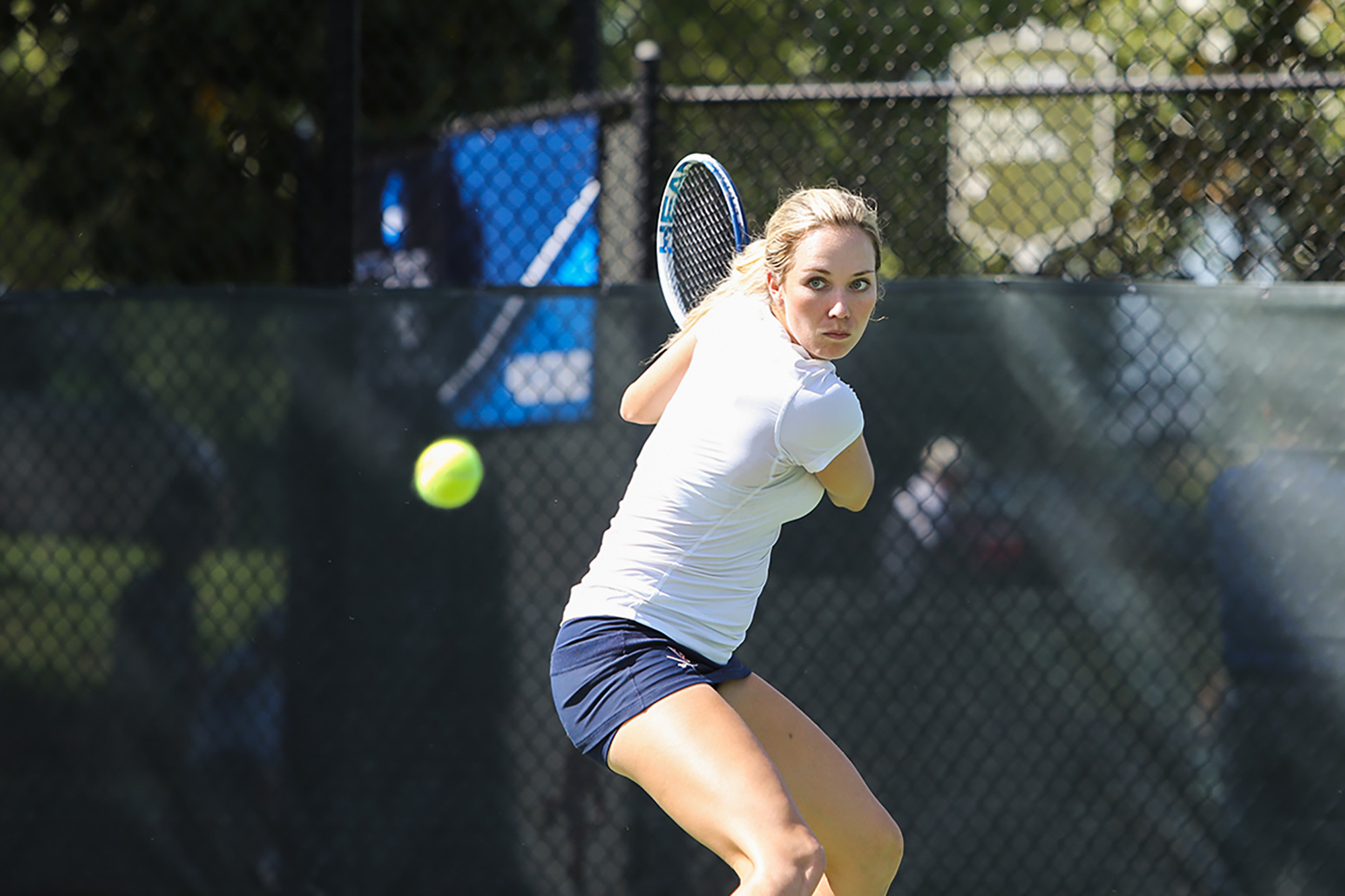 Danielle Collins about to hit a tennis ball during a match