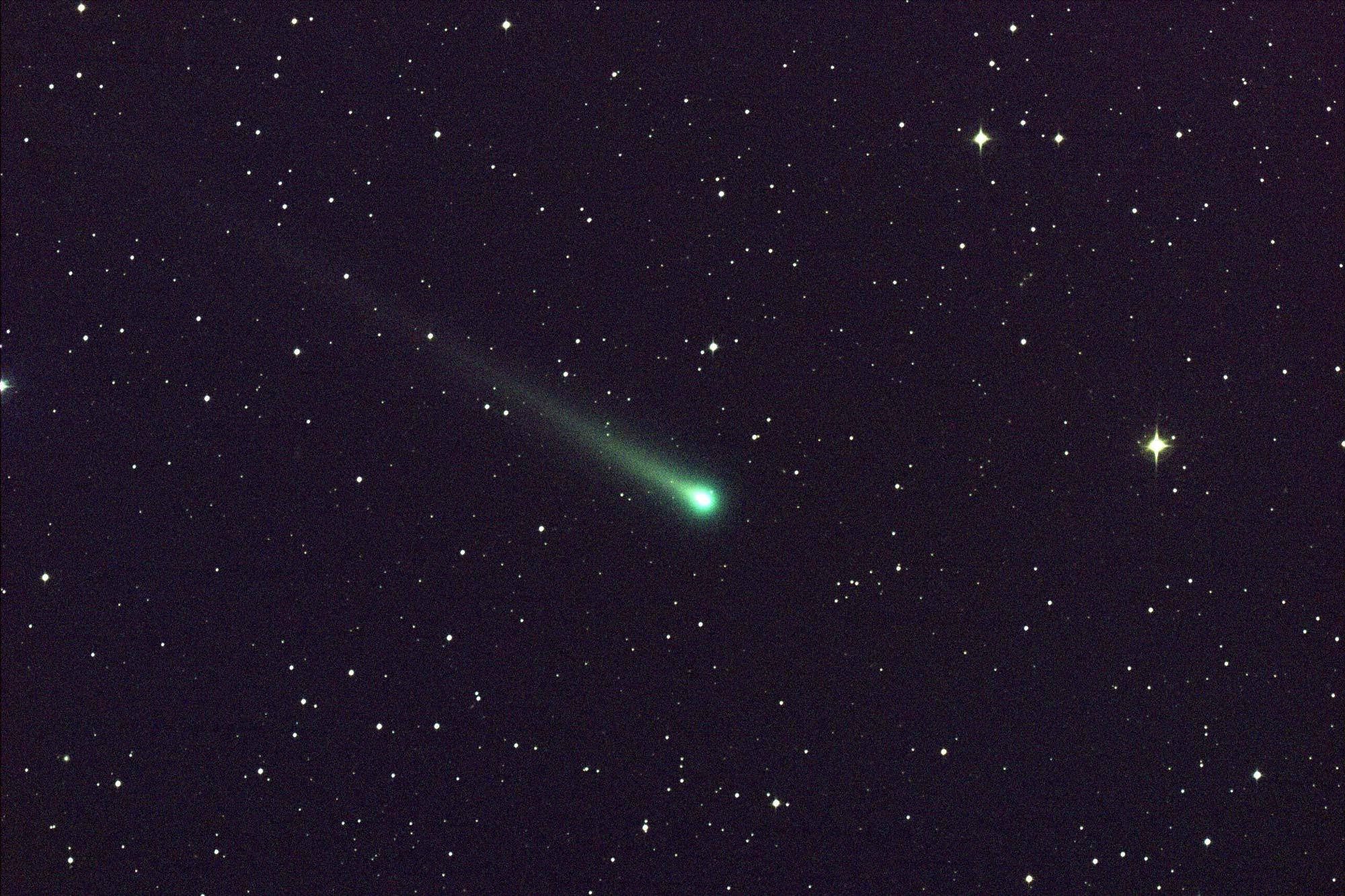 The comet ISON soaring across a star filled backdrop