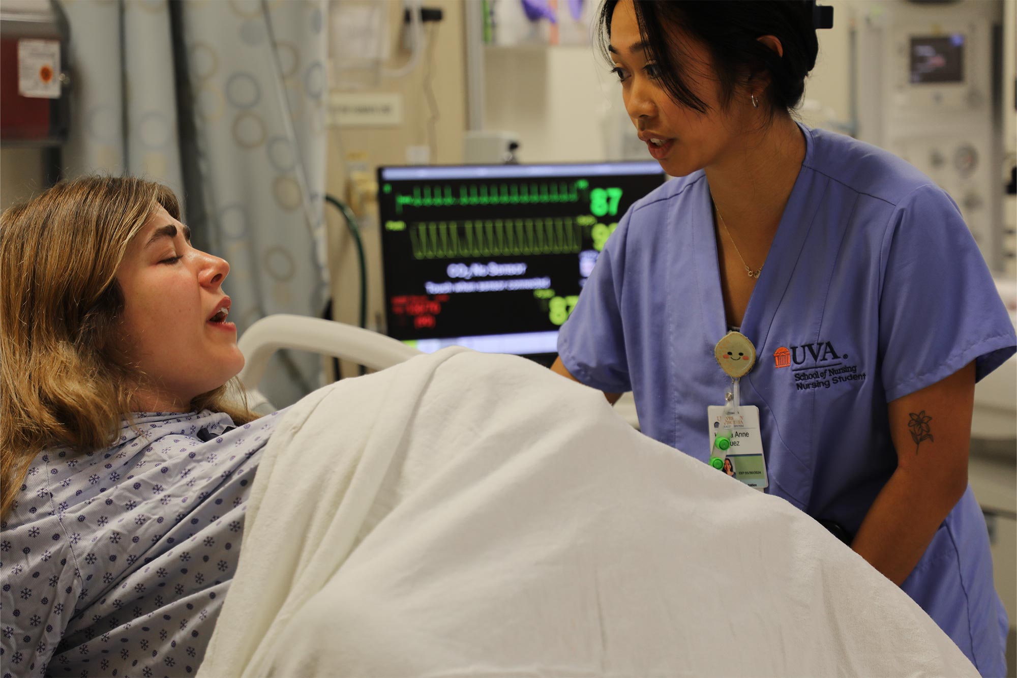 Nursing student practices assisting a patient in labor scenario