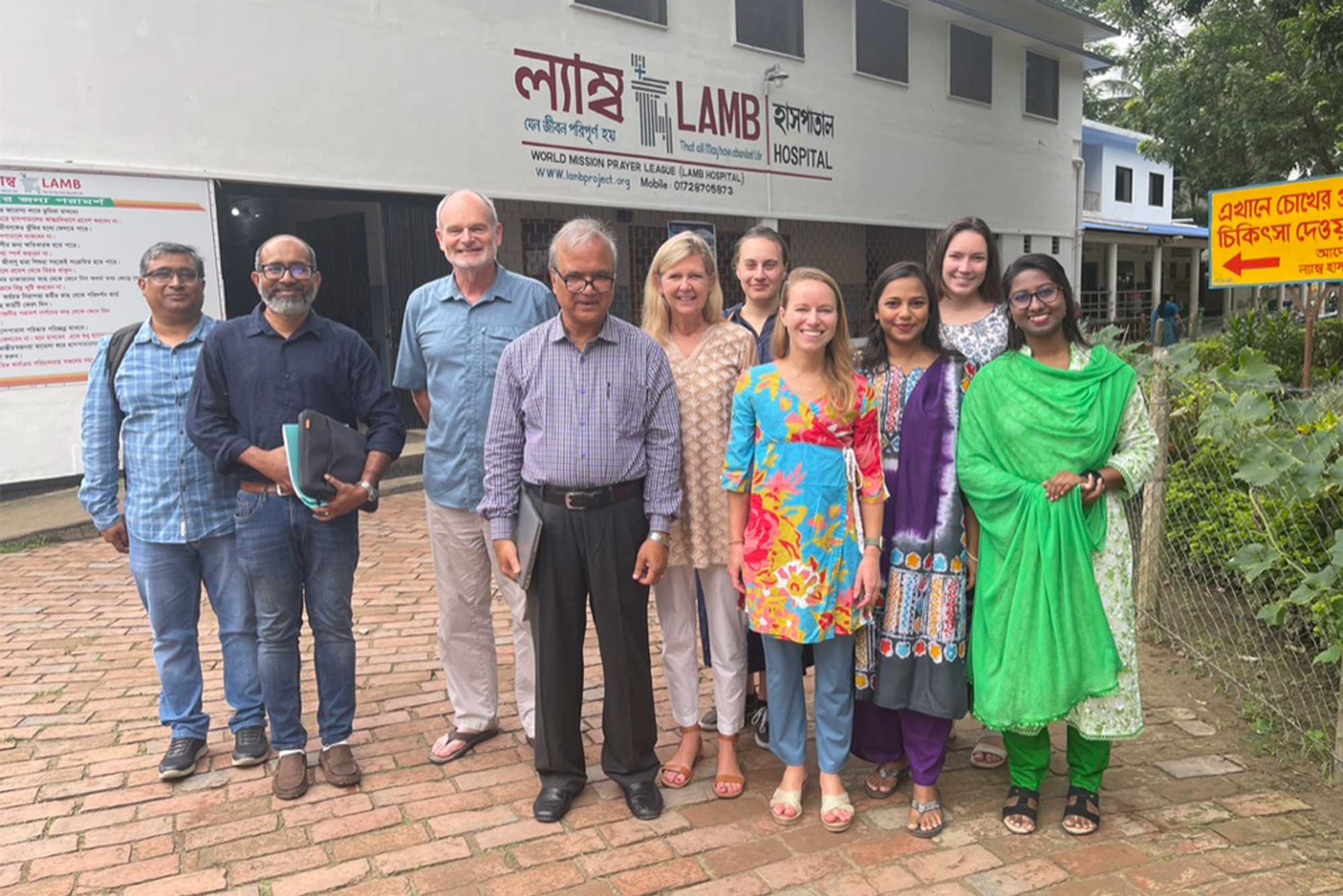 Group photo of Dr. William Petri and researchers standing outside a hospital in Bangladesh