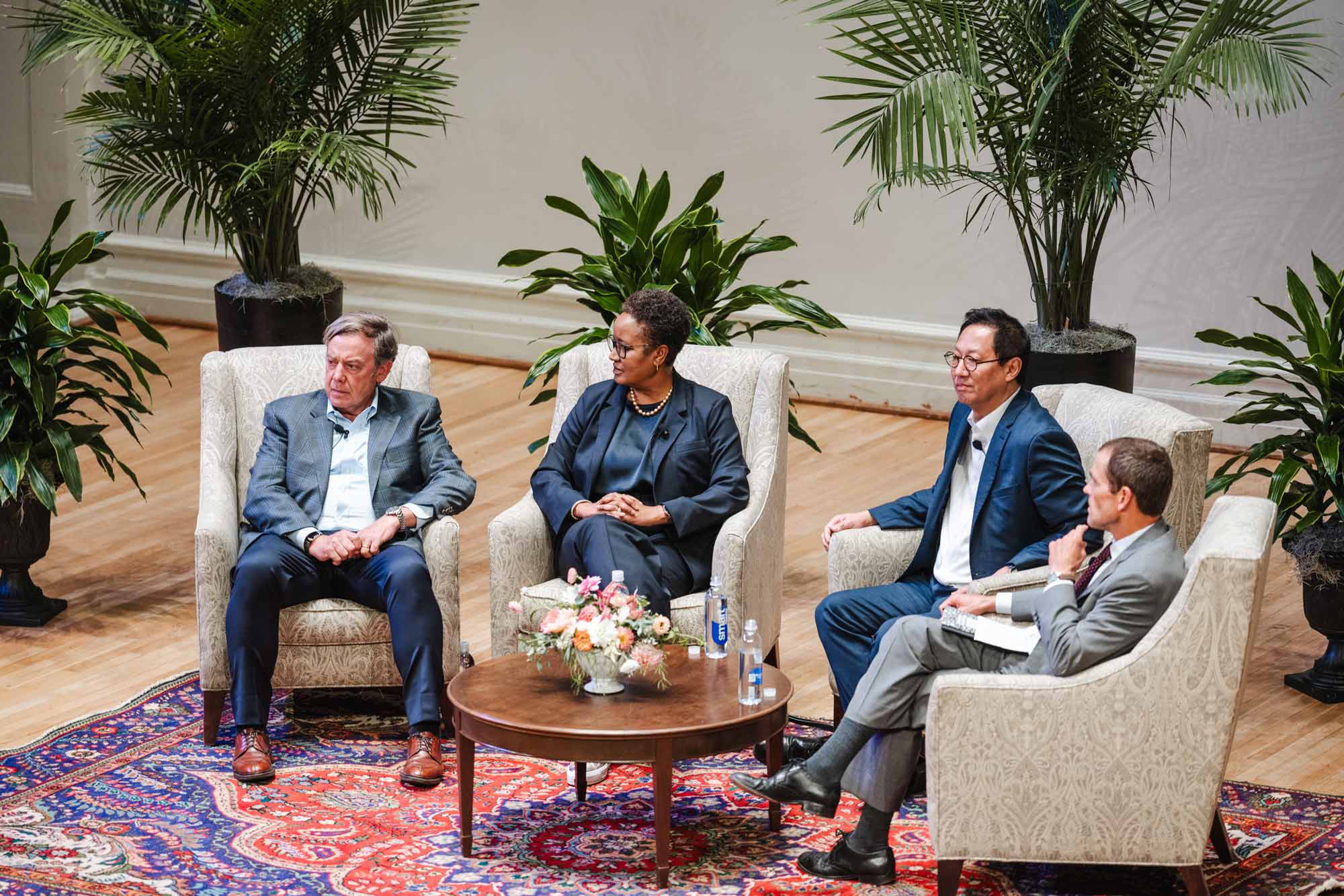 Candid portrait of President Jim Ryan with other panel members, including the heads of the University of Michigan, Harvey Mudd College, and Arizona State University.