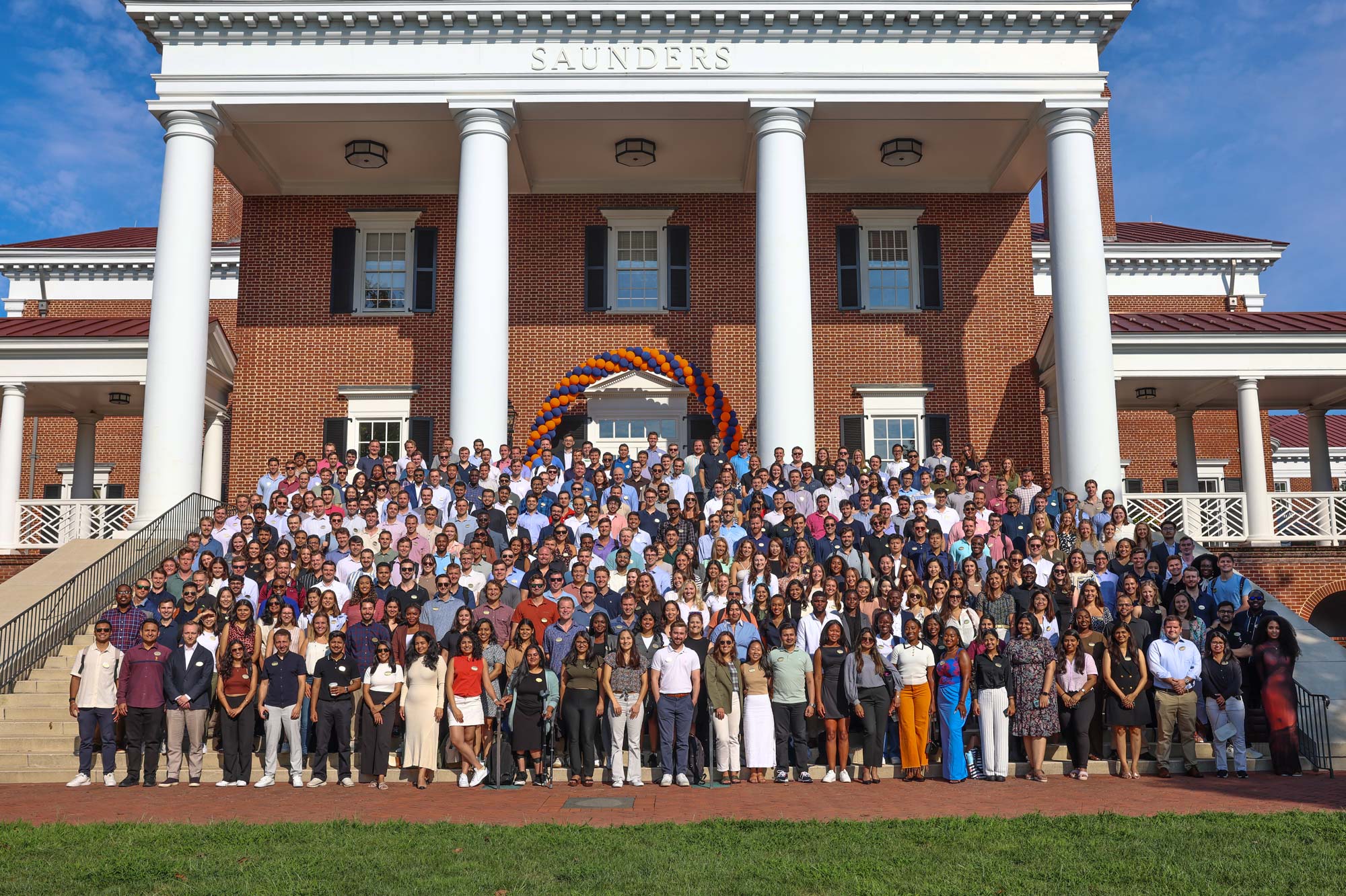 Darden's class of 2026 on the steps of Saunders Hall.