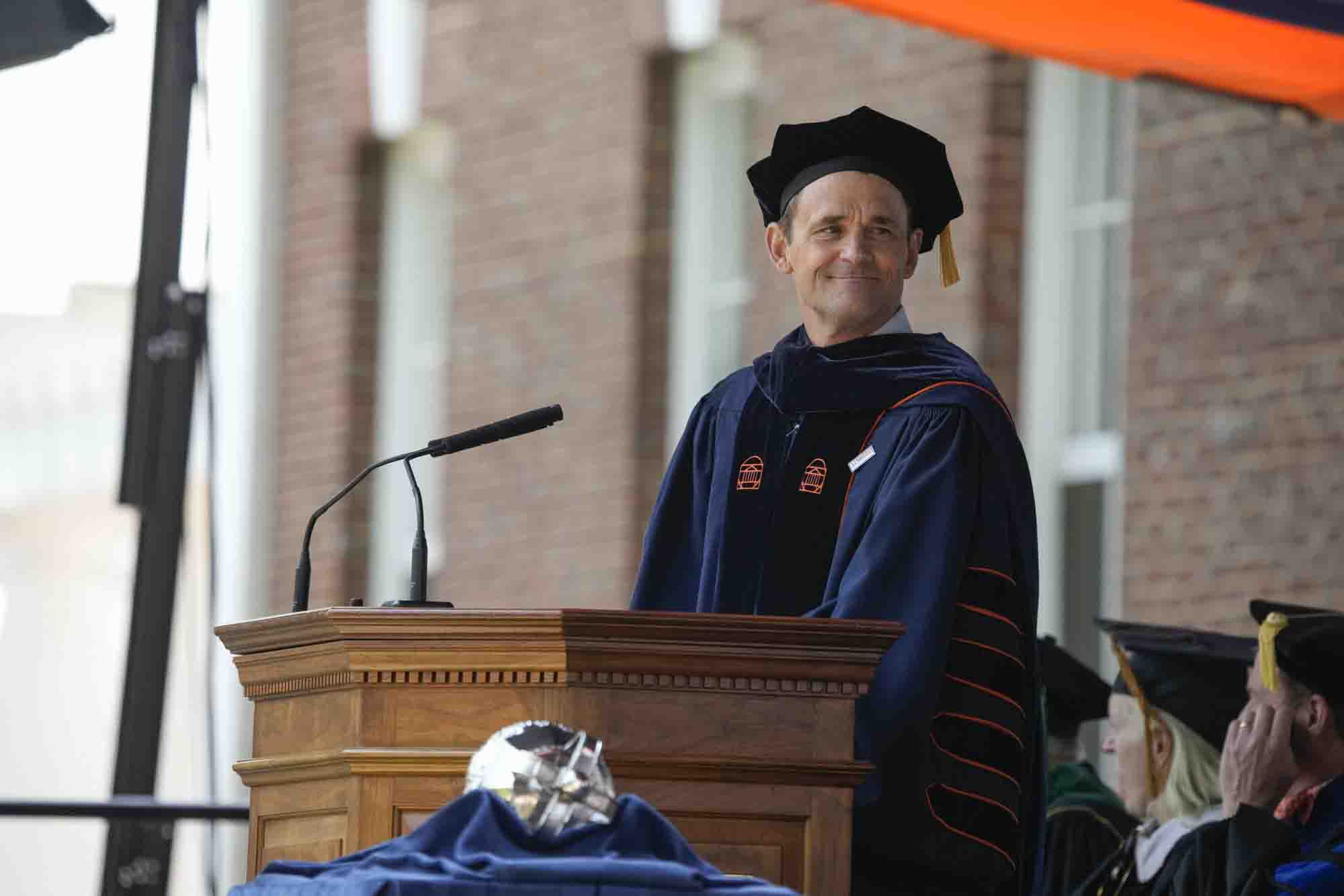 President Ryan at the podium addressing the graduates