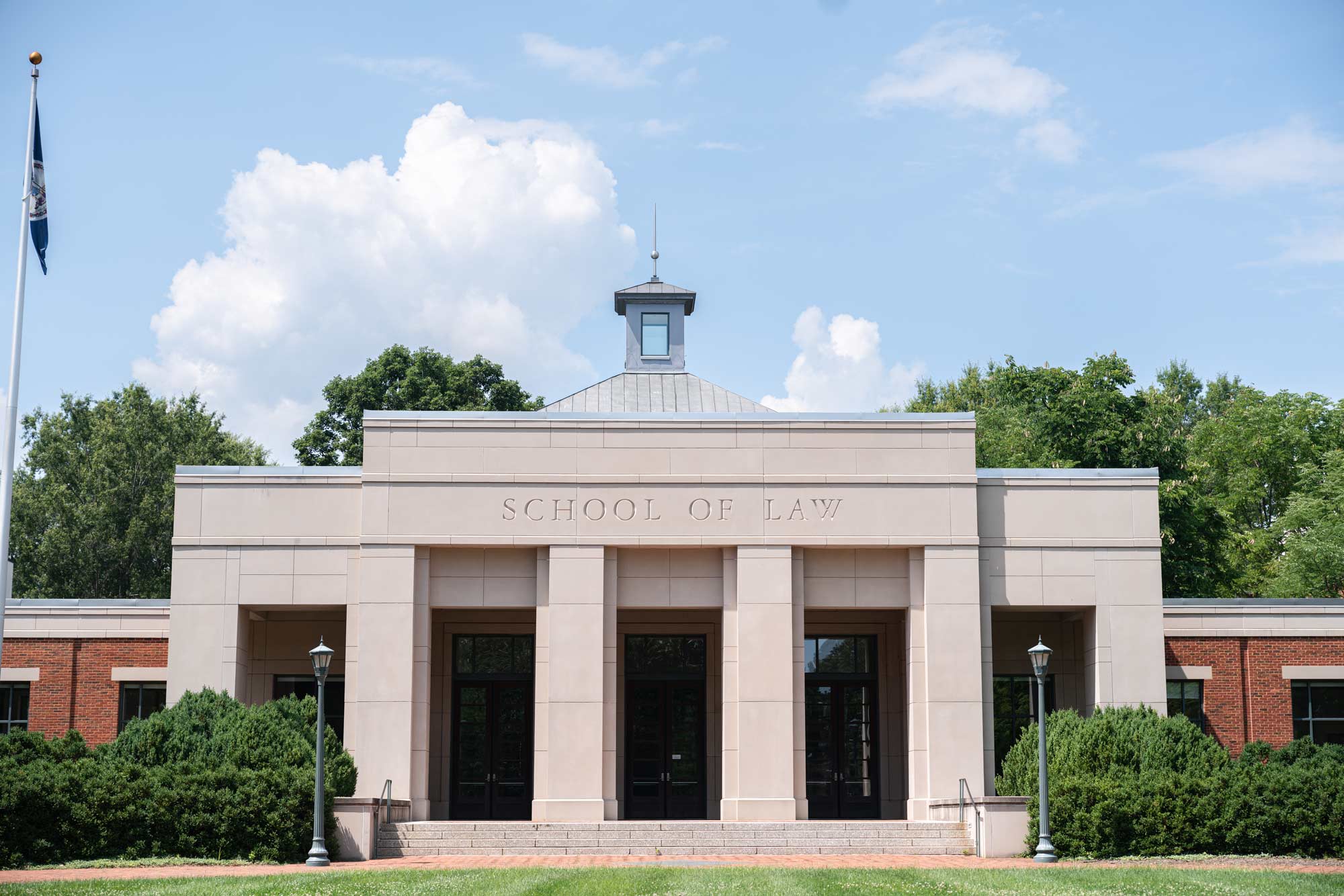 The School of Law at UVA during a beautiful day with blue skies and clouds.