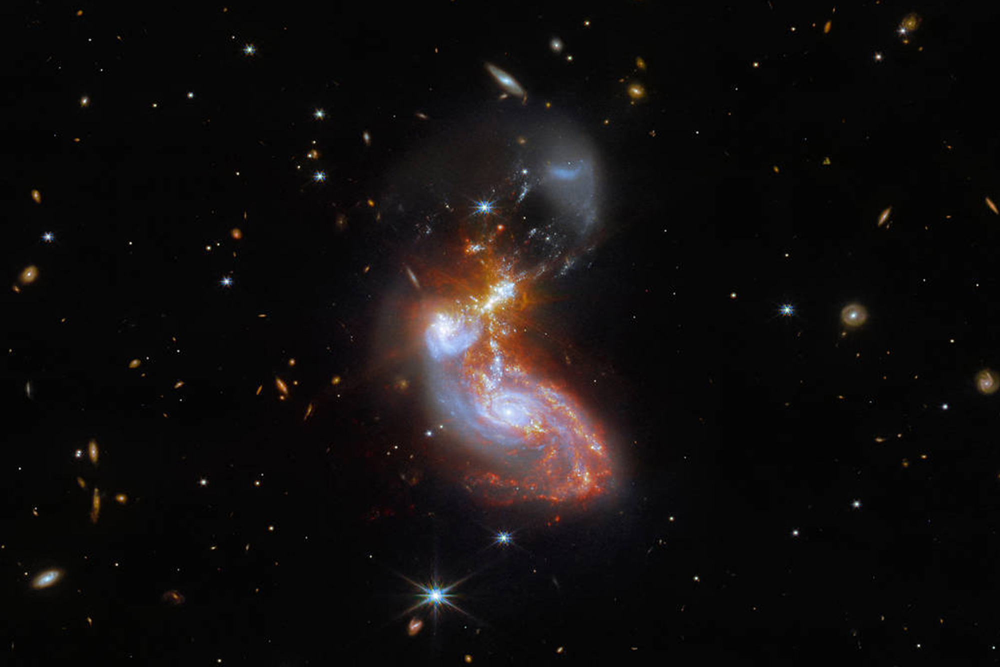 Photo of deep space and multiple galaxies within it