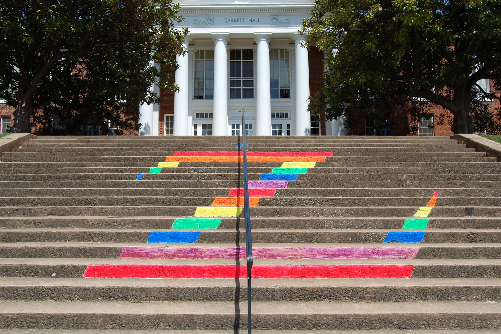 The letter Z is painted in rainbow colors on the concrete stairs leading up to Garrett Hall