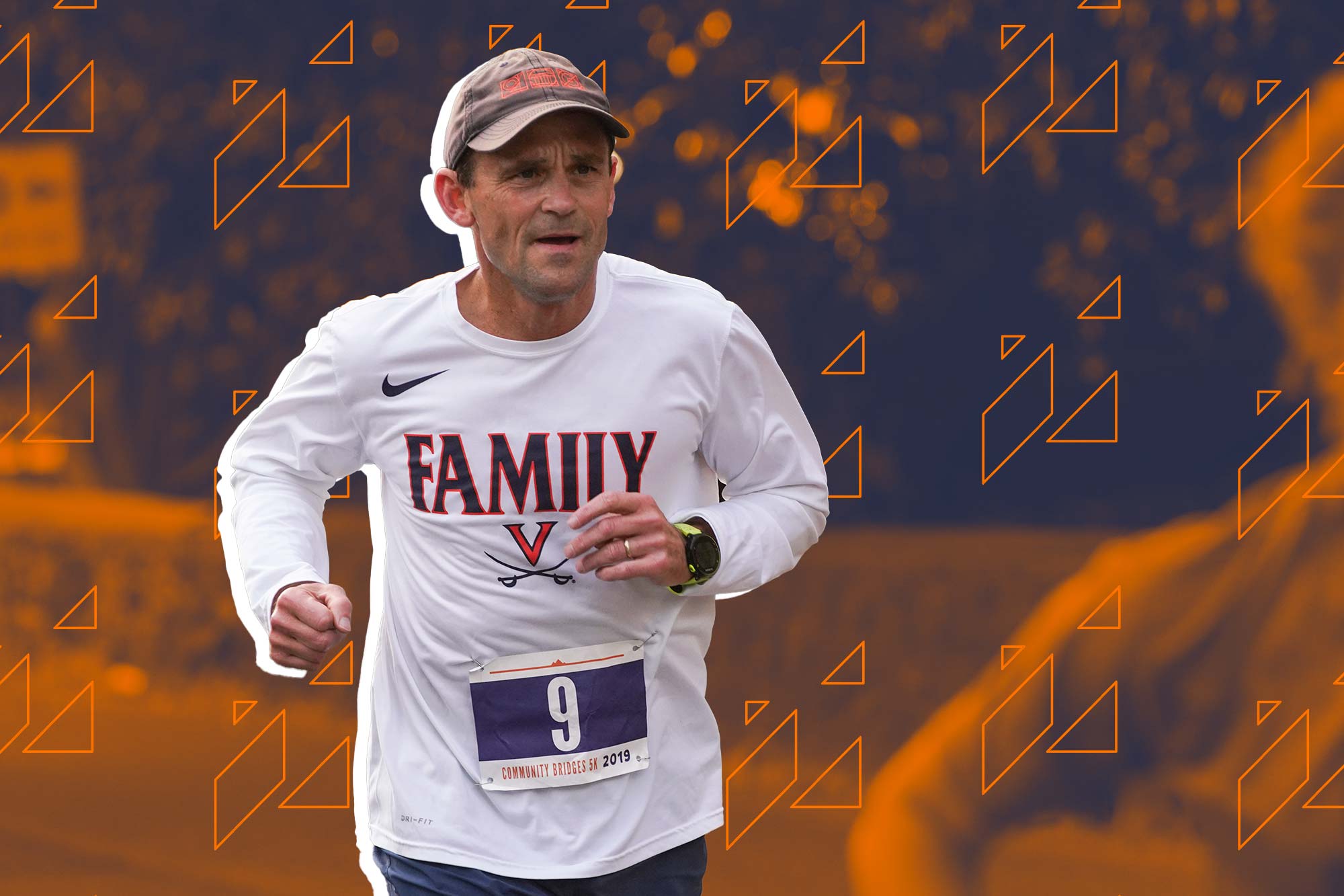 UVA President Jim Ryan running a marathon with the number 9 taped to his shirt