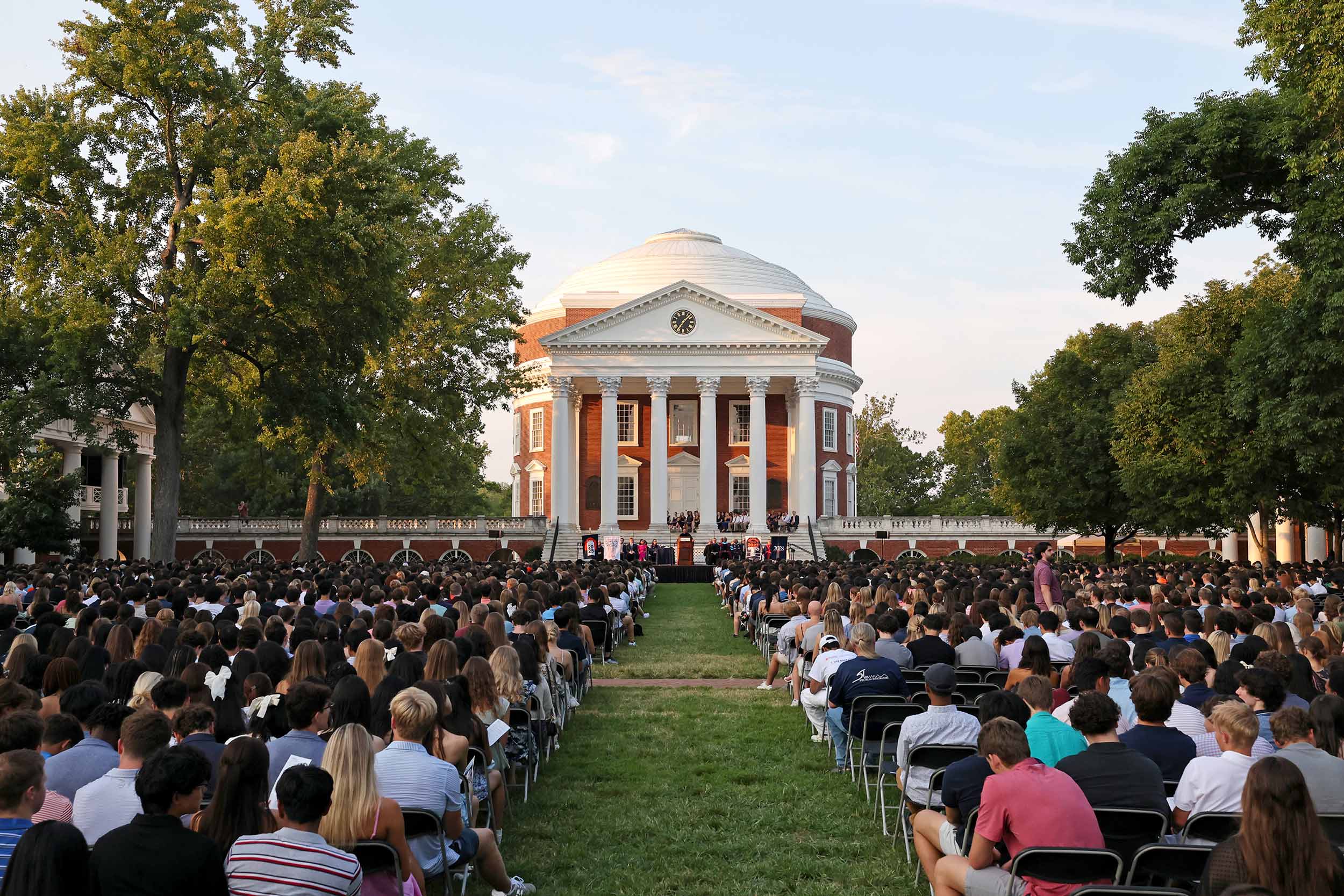 Students sit in front of the Rotunda during convocation