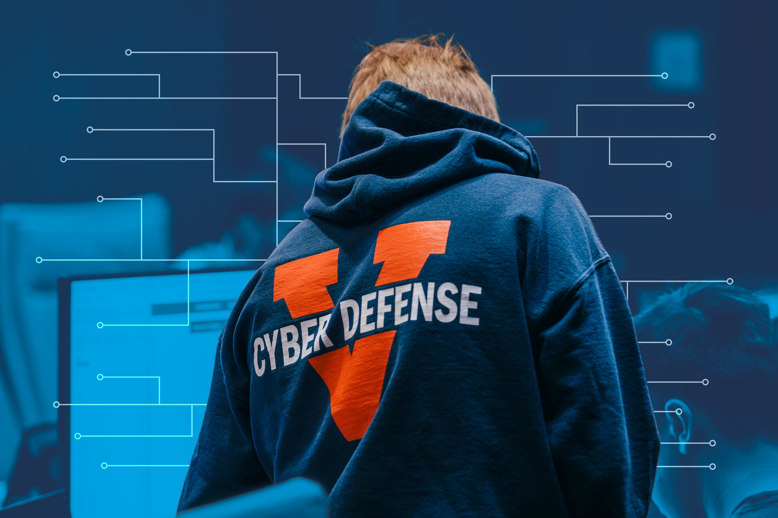Cyber graphic below a student wearing a cyber defense sweatshirt