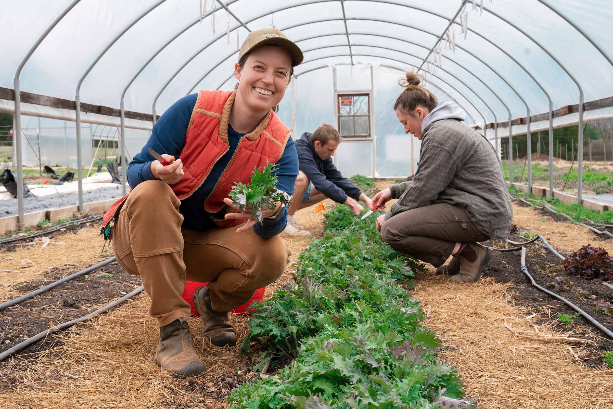 Portrait of Fiona Flynn inside a greenhouse