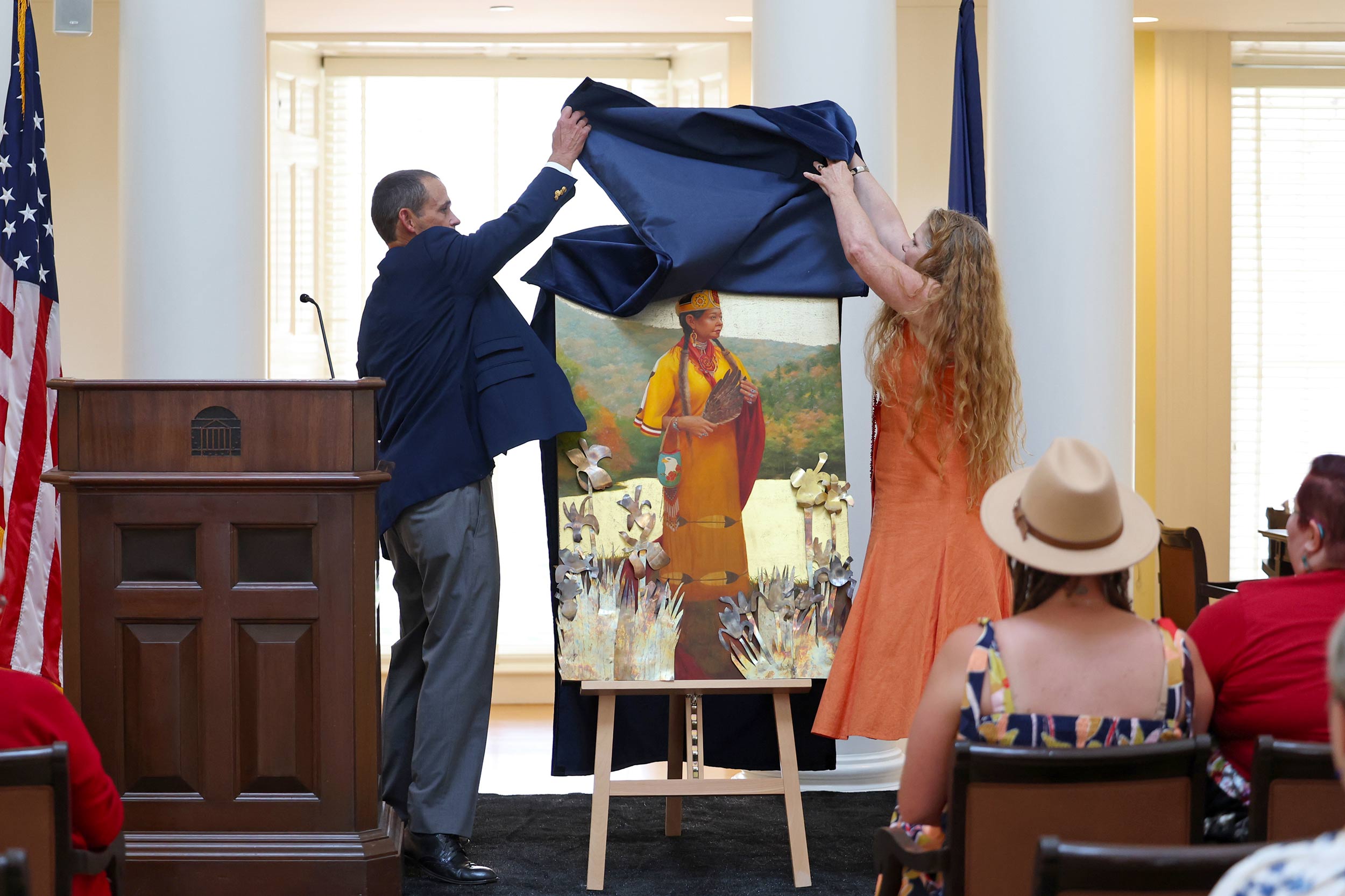 UVA President Jim Ryan and Teresa Pollack, a member of the Monacan Indian Nation, unveil a portrait of Karenne Wood in the Rotunda’s Dome Room. 