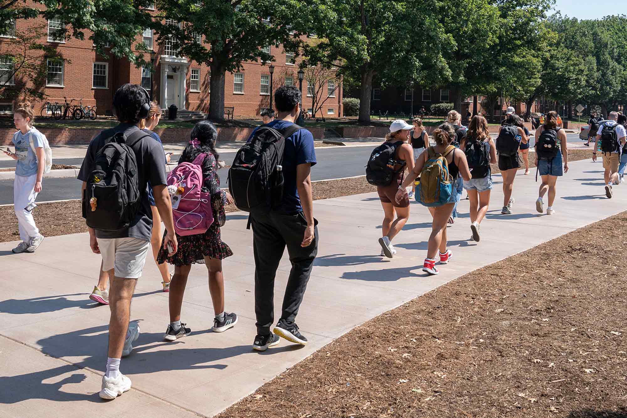 Students walking to class on McCormick Rd sidewalk