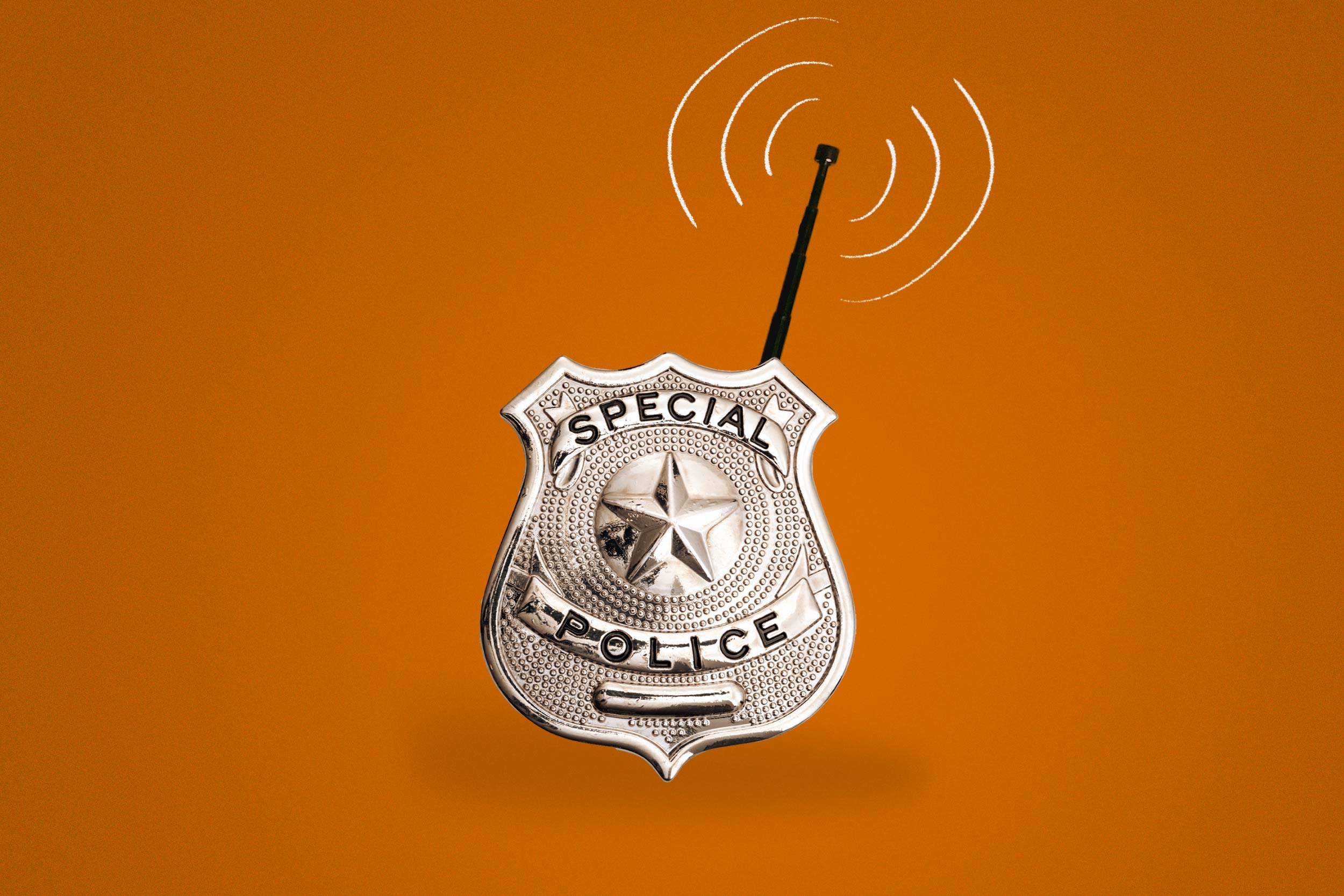 Police badge with an antenna sticking out of it receiving a signal