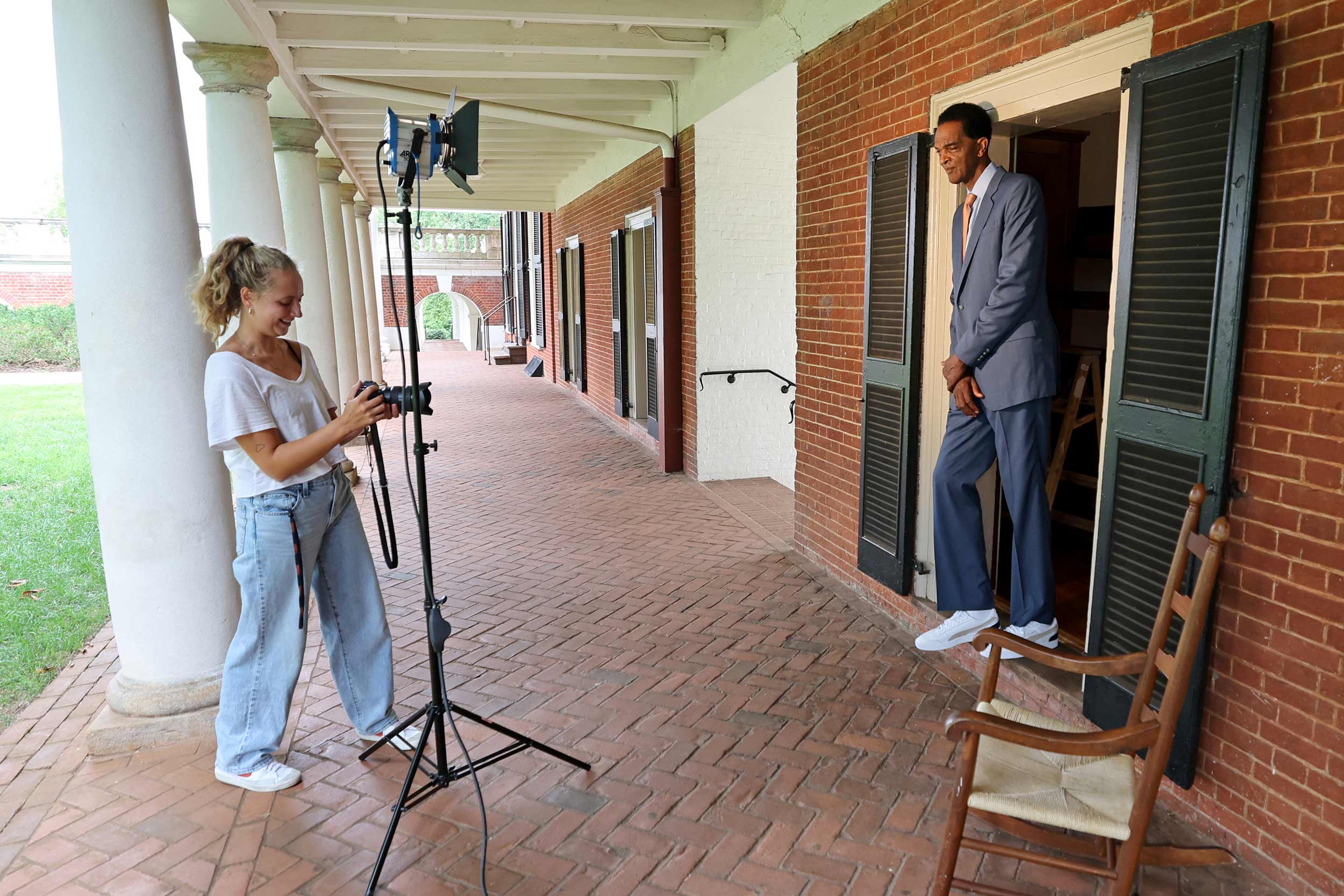 UVA Today photographer, Emily Faith Morgan photographs Ralph Sampson in the doorway of his old Lawn room