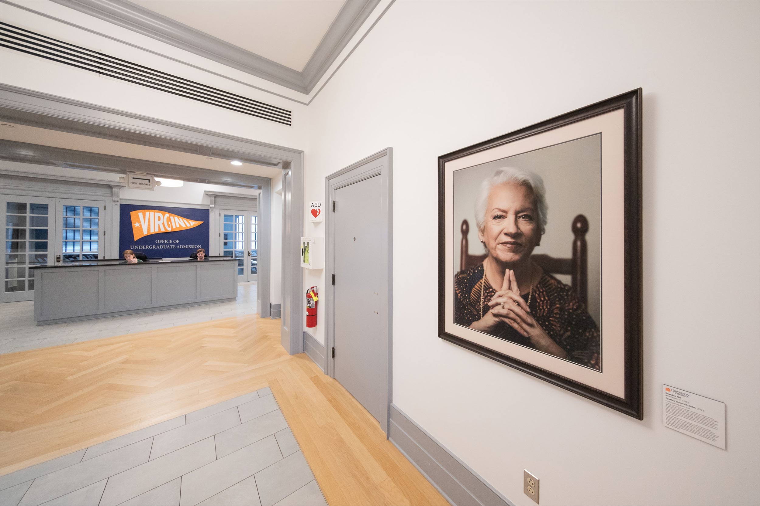 Side view of a portrait of Cynthia Kuhn hung on the wall