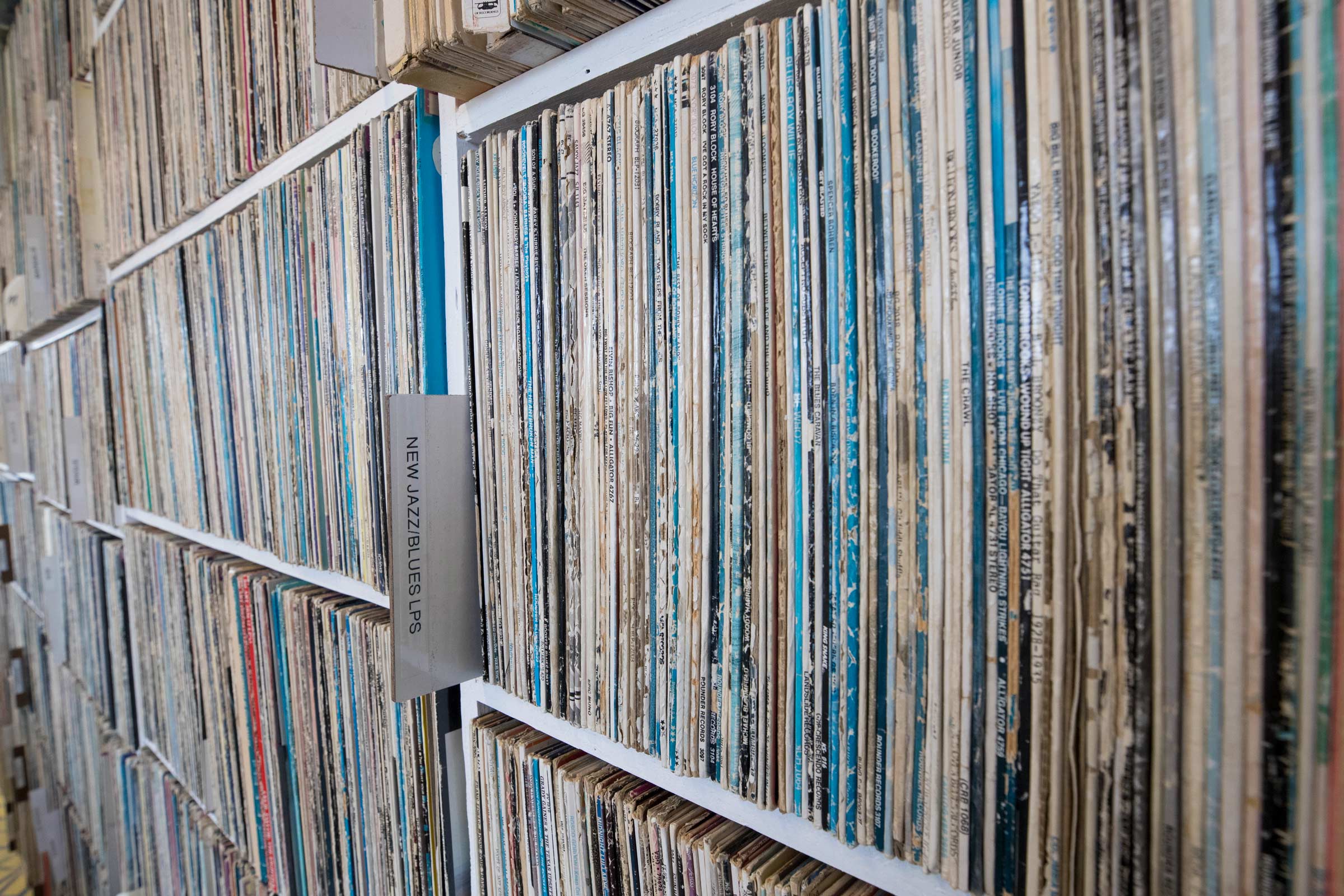Close up of shelves filled with old records