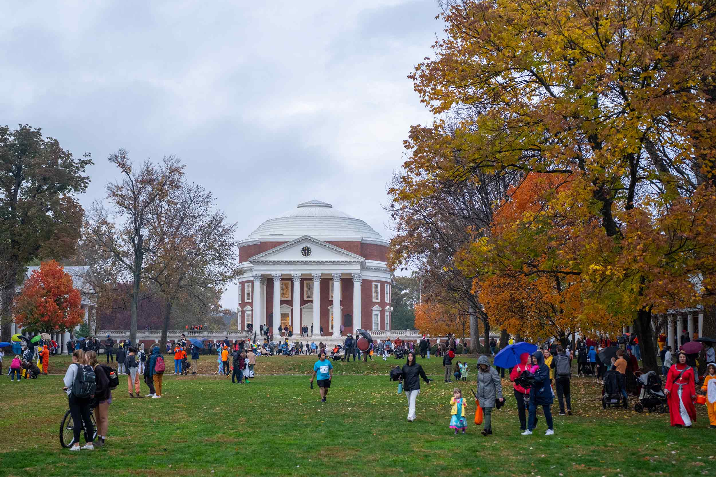 People dressed in costumes trick or treating on the Lawn