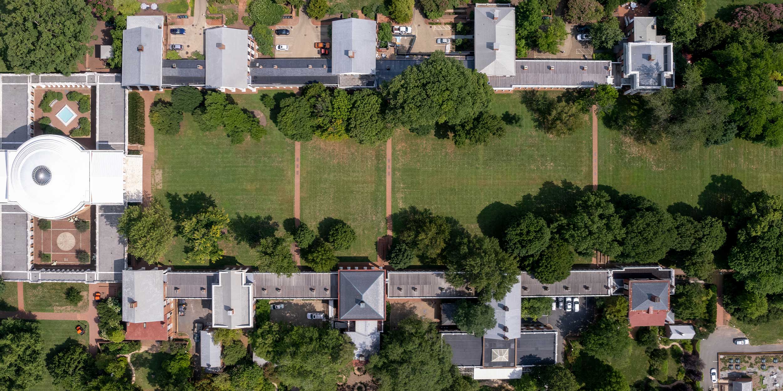 Aerial photo showing the Lawn with the grass green and grown in from the Rotunda on the left and Old Cabell Hall on the right